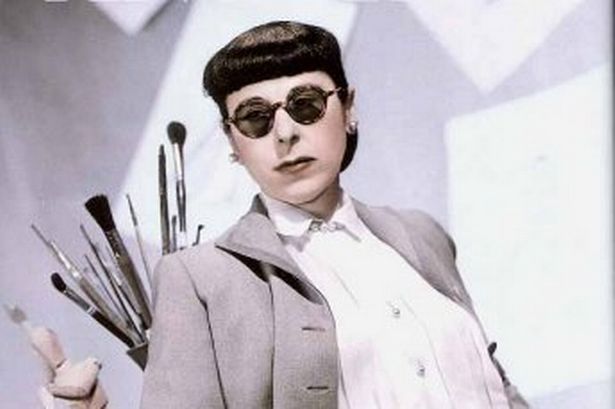 Edith Head wearing her trademark round glasses