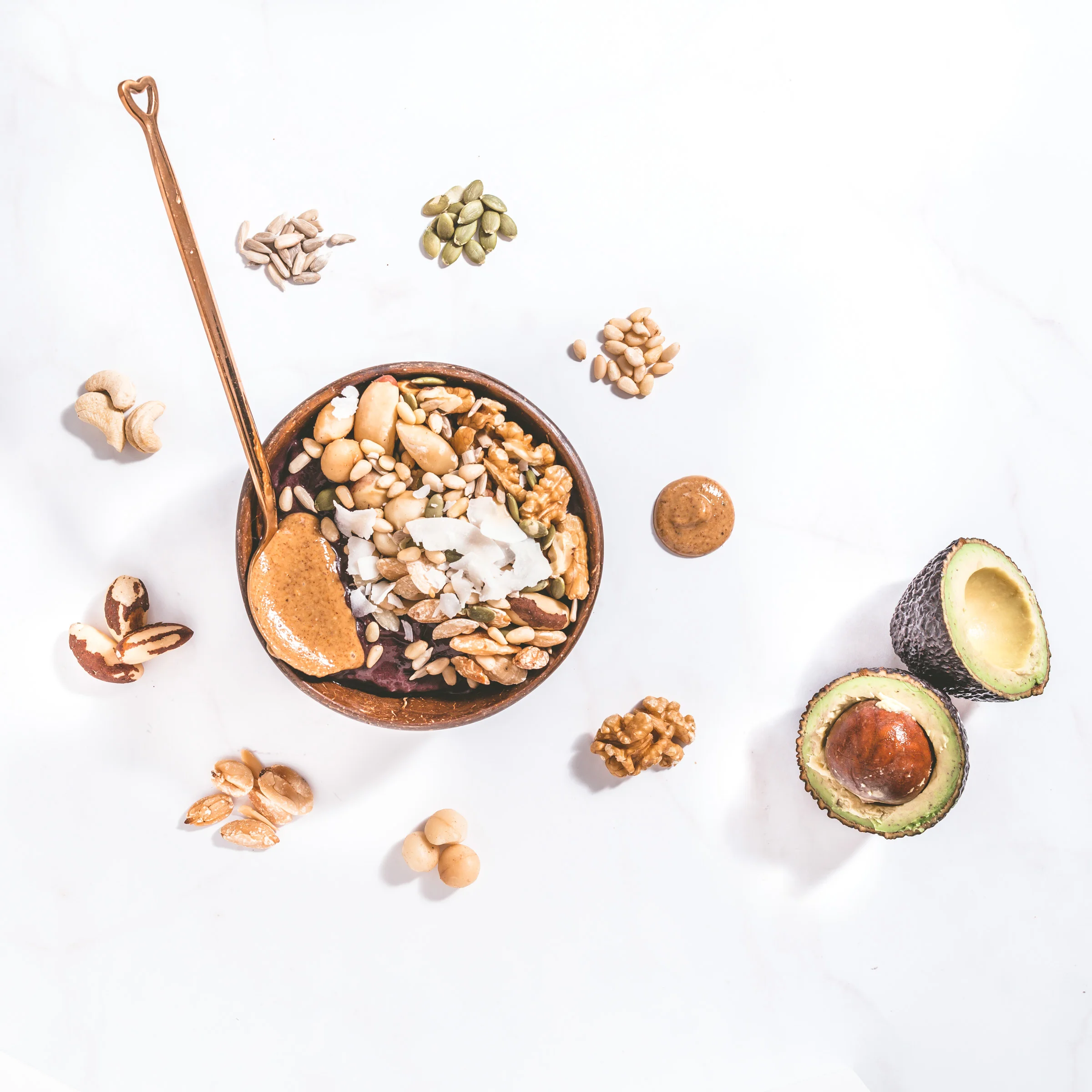 Keto Açaí Bowl blended with Poppy & Co. Organic Açaí Berry pulp and avocado, topped with a mixture of healthy nuts and seeds, finished with a spoonful of creamy almond butter