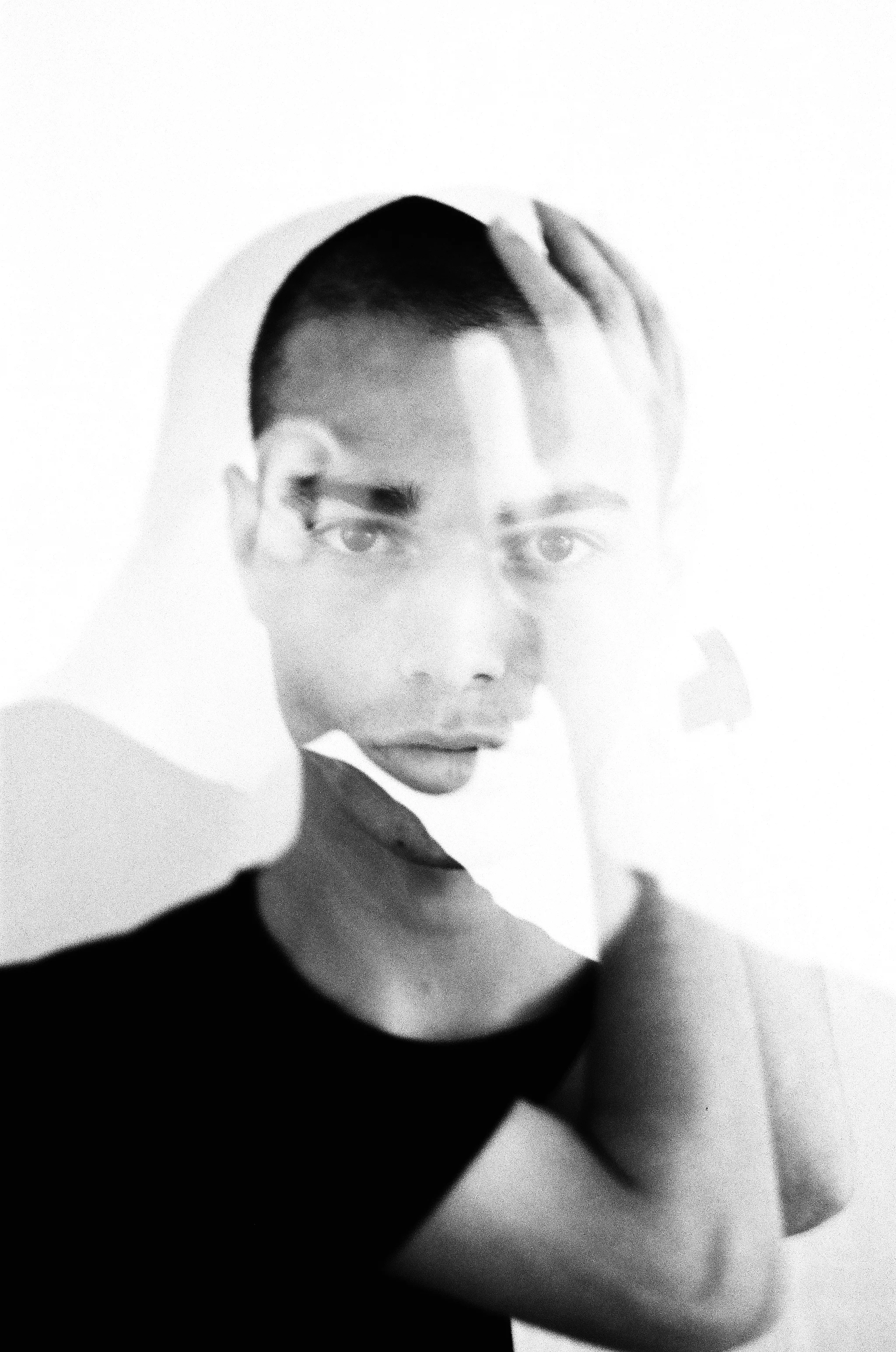 Black and white double exposure portrait of model David Friend