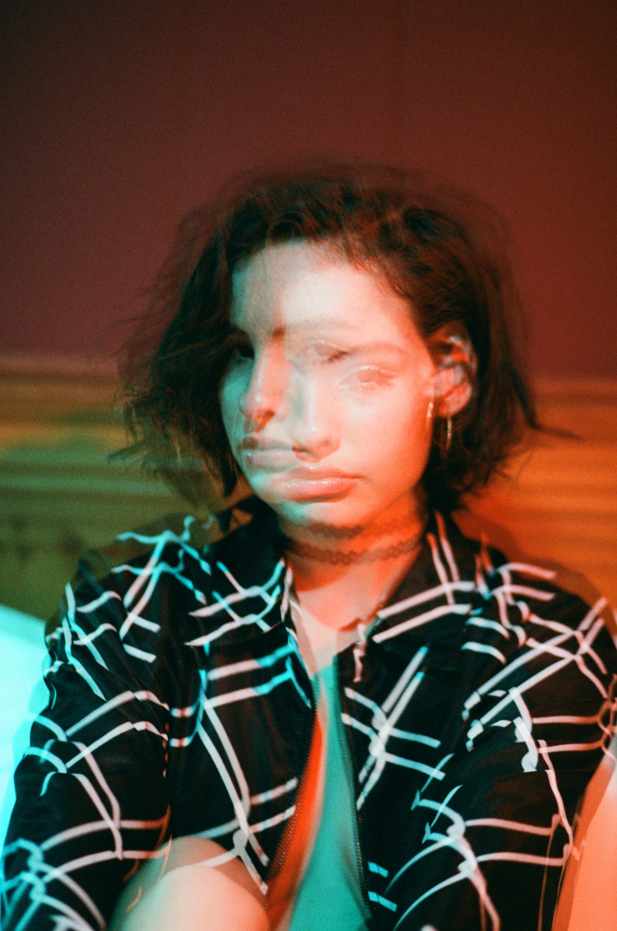 Vibrant green and red double exposure portrait on film