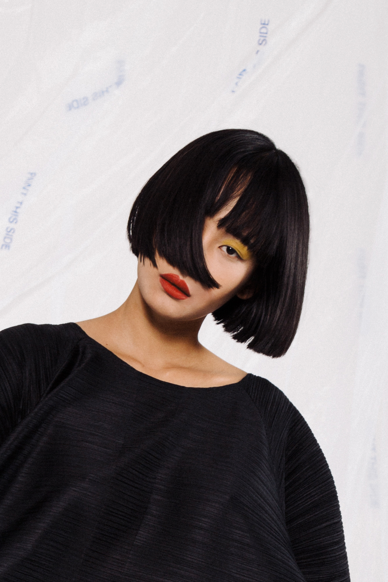 Portrait of Miki Hamano wearing yellow eyeshadow and a bright red lip