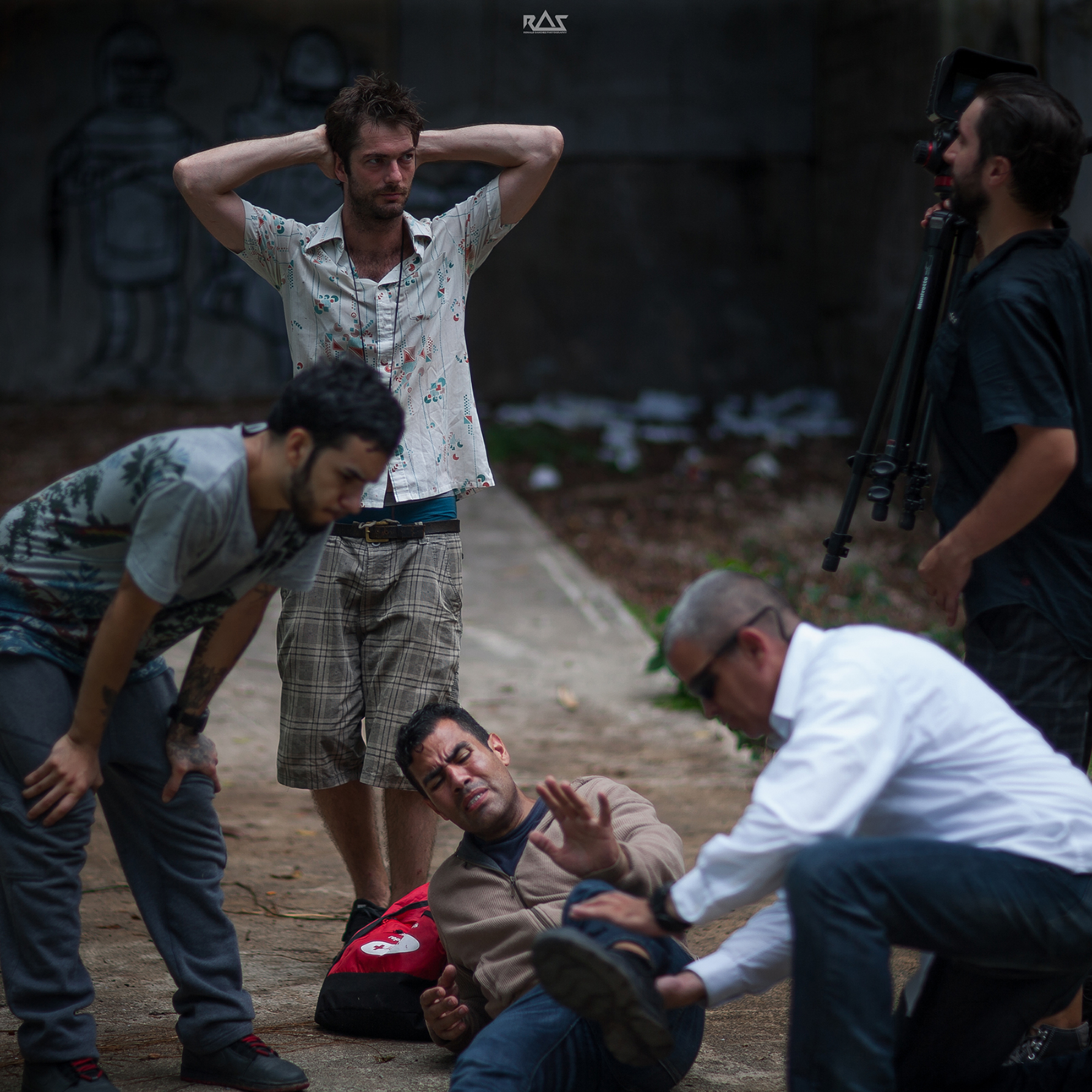 Mark Castro looks pensive as Jesus Reyes la Salle aids J.W. Cortés. Producer/director Michael Biggam shares a moment with producer/DoP David Mondin.
