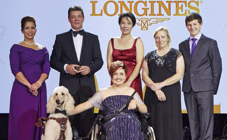 2014 winners from left to right: HRH Princess Haya, Jeroen Dubbeldam, Melissa Tan chairman of equine therapy centre Equal Ark, Jackie Potts, Lambert Leclezio with (centre) Sydney Collier and her service dog Journey. Photo: FEI/Liz Gregg