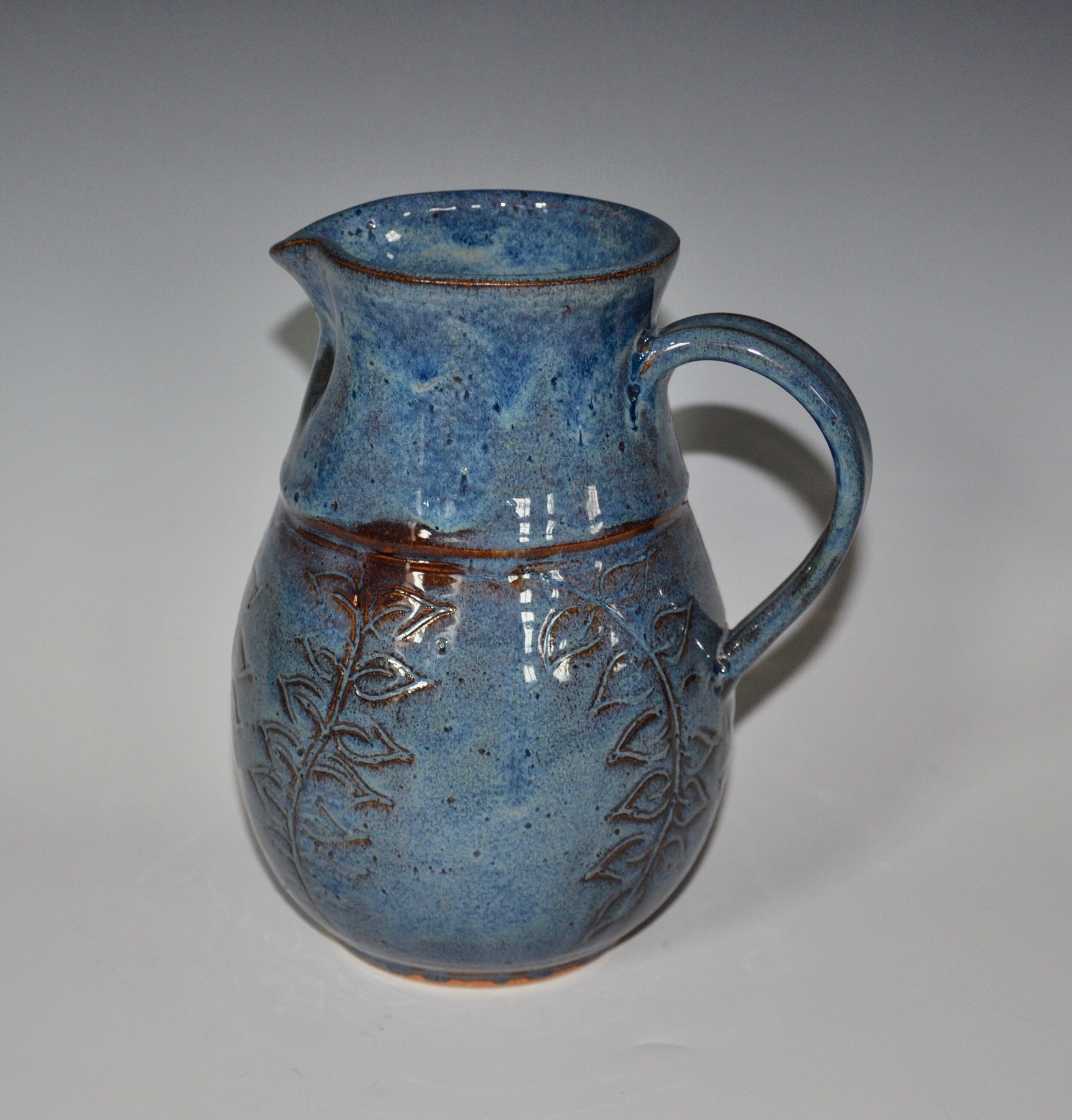 Rutile Blue Pitcher with Vine Etching