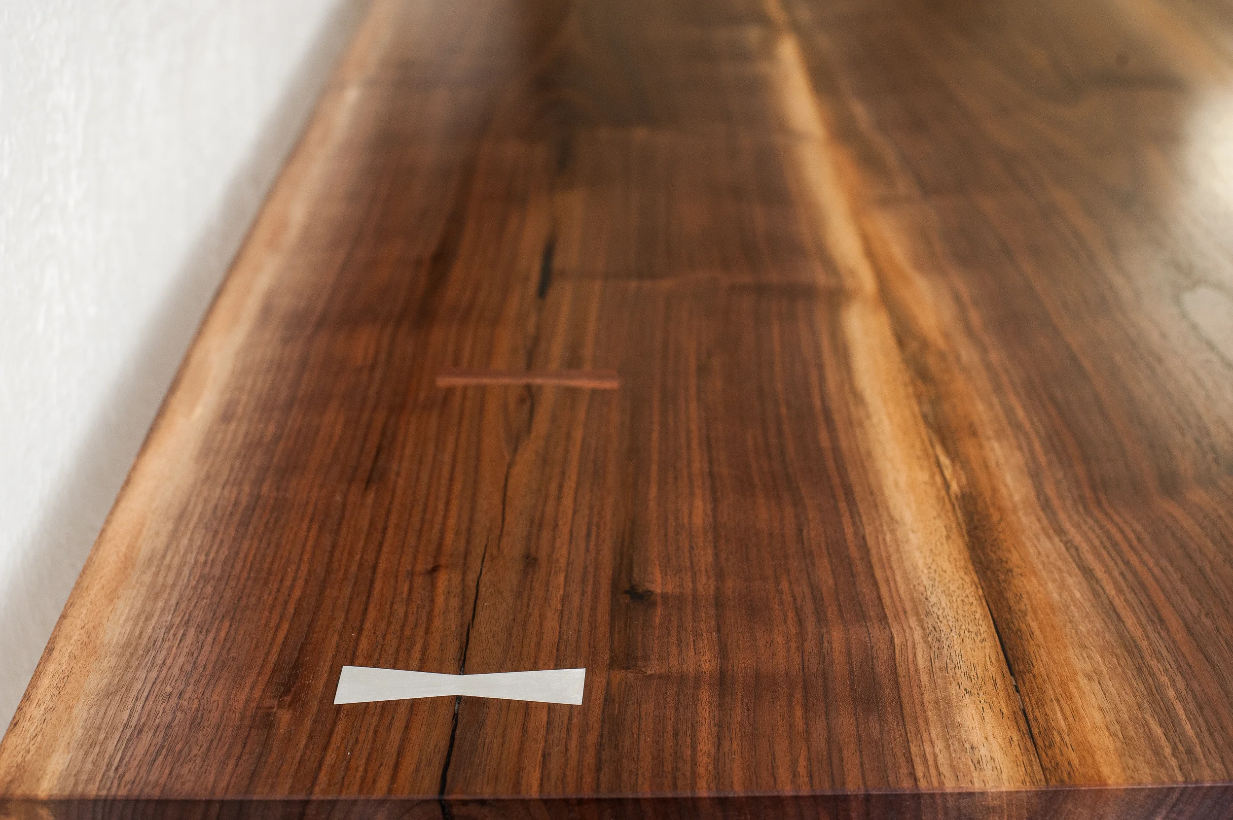 Aluminum and Walnut butterfly joints