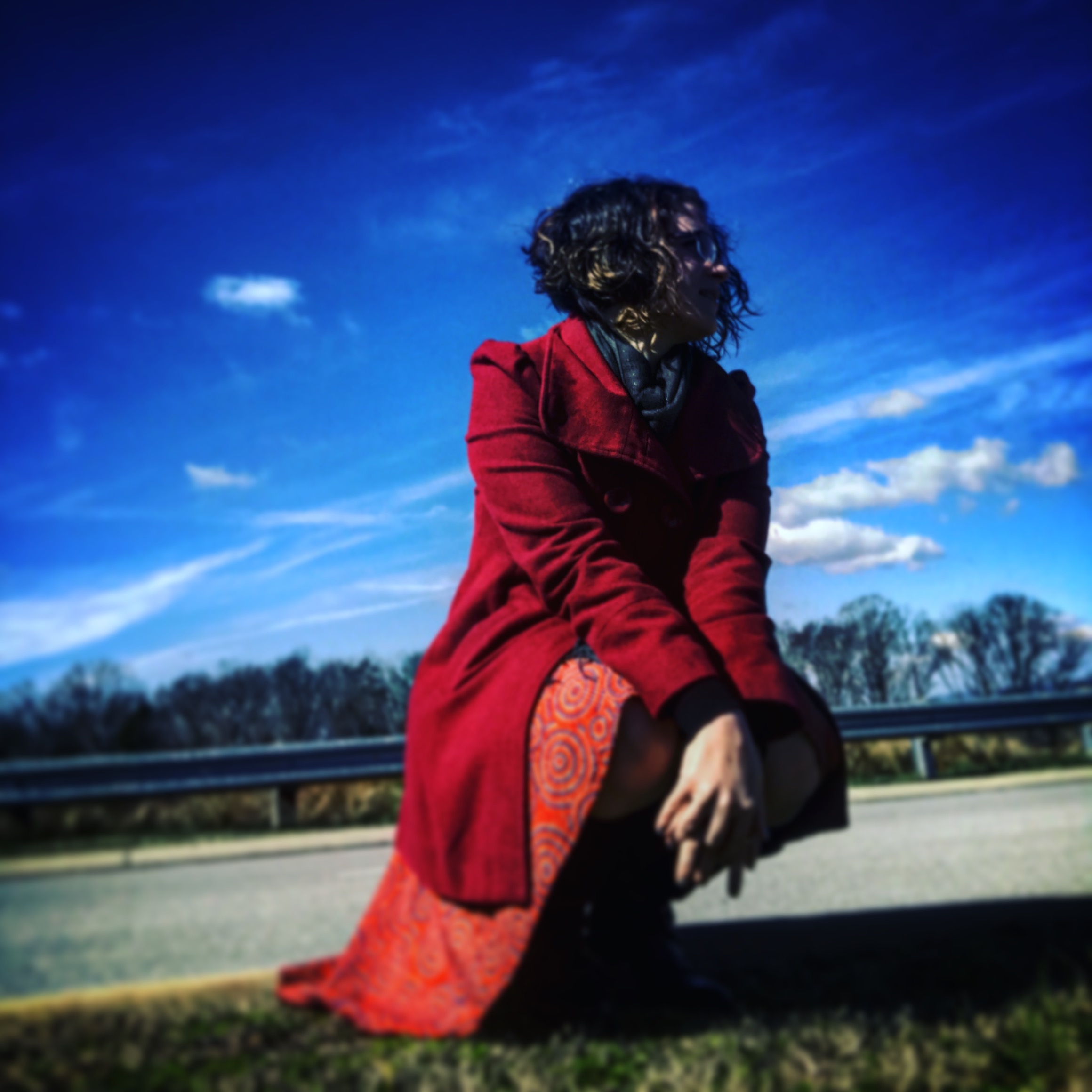 A new hair cut, a twirly skirt, a red coat, and the sunshine.