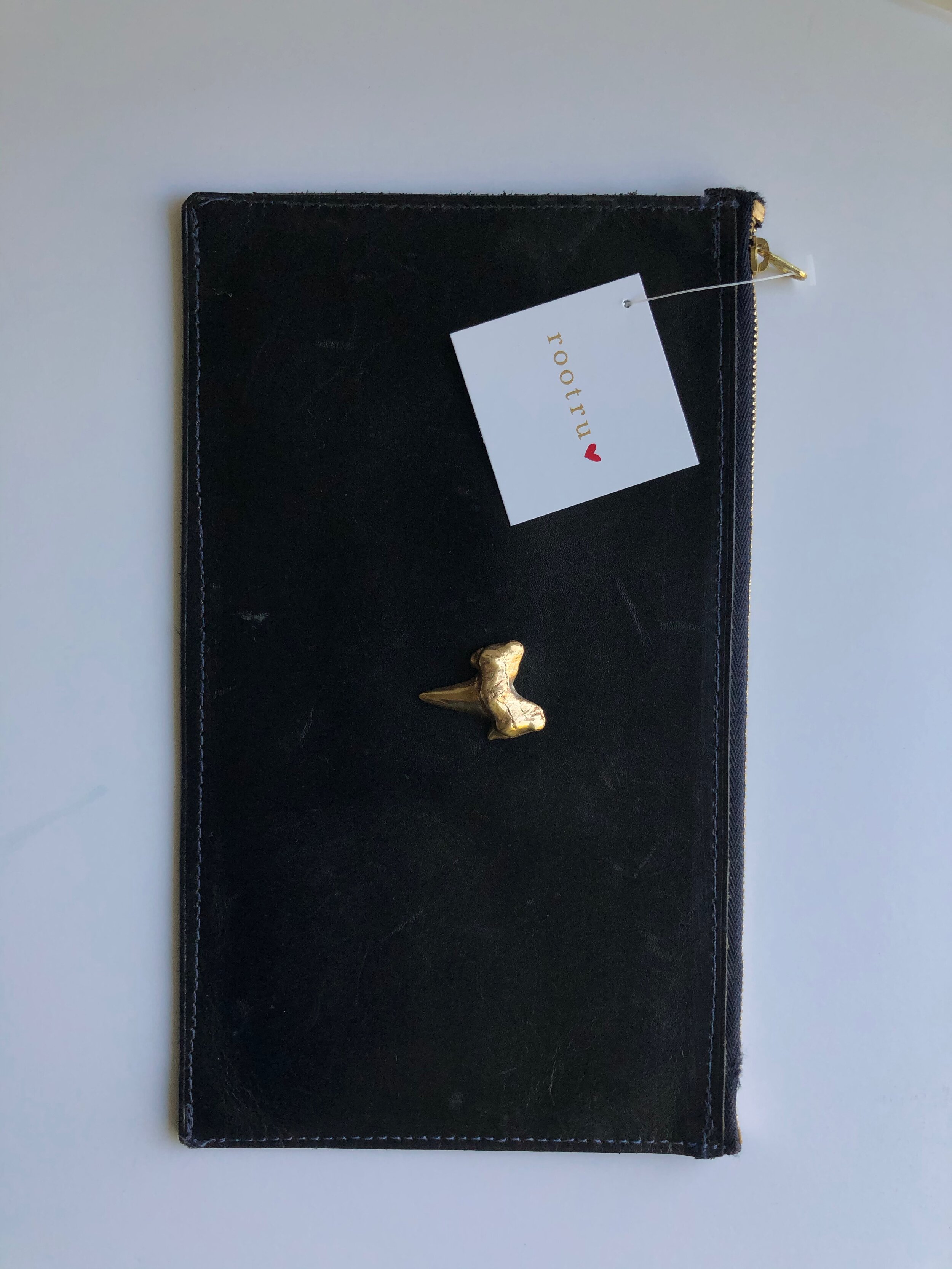 Hand sewn leather clutch. 