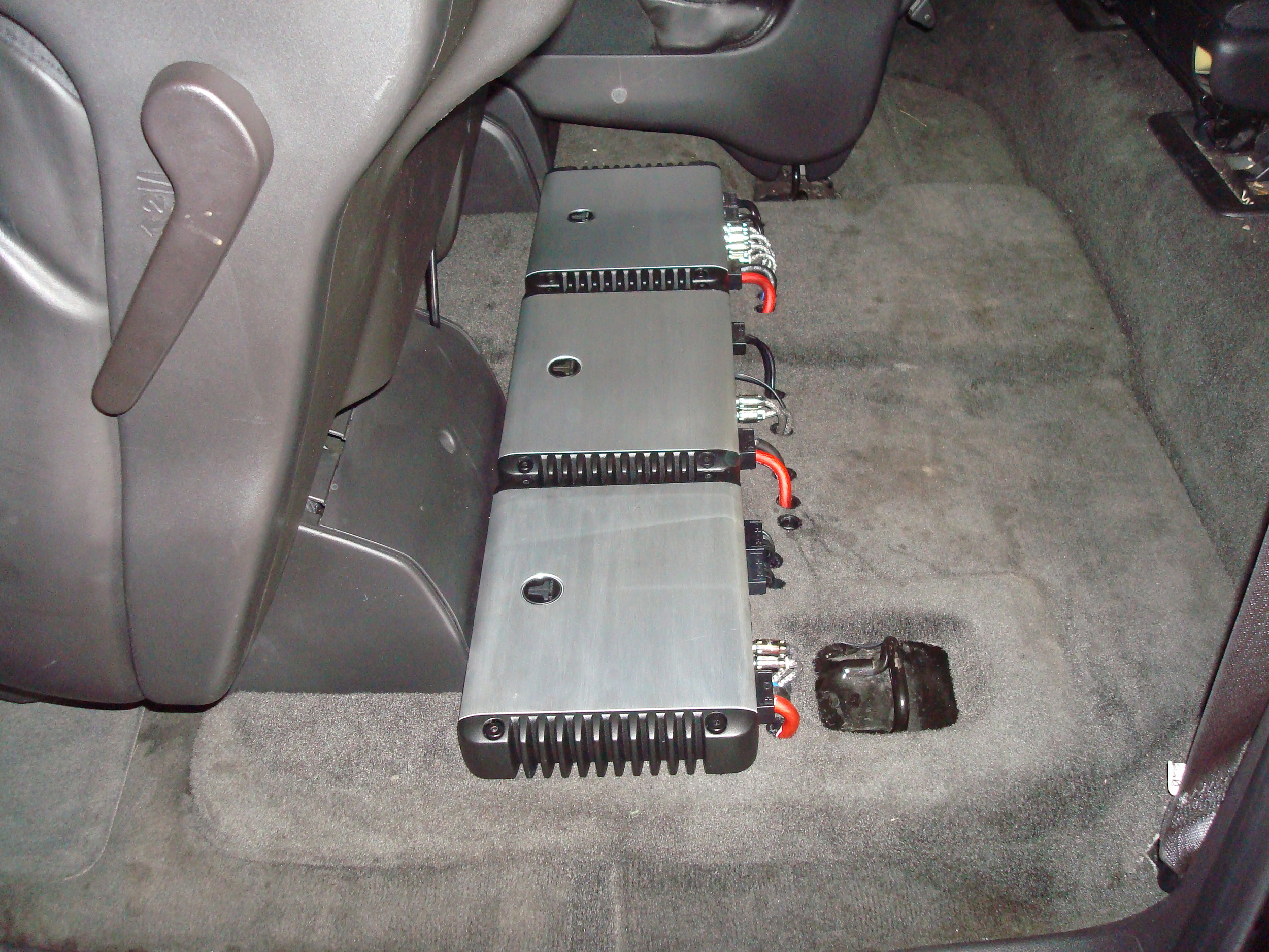 2007 Yukon Denali XL - JL Audio HD Amps completely hidden underneath the 2nd row seat