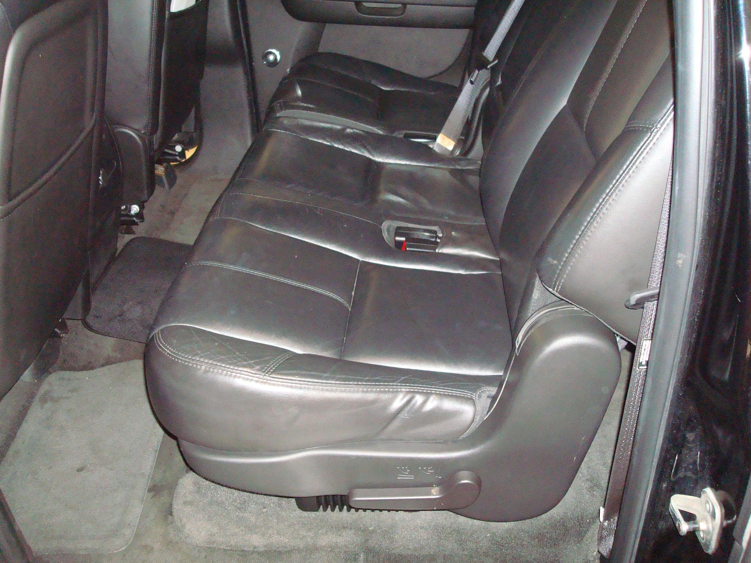 2007 Yukon Denali XL - JL Audio HD Amps completely hidden underneath the 2nd row seat
