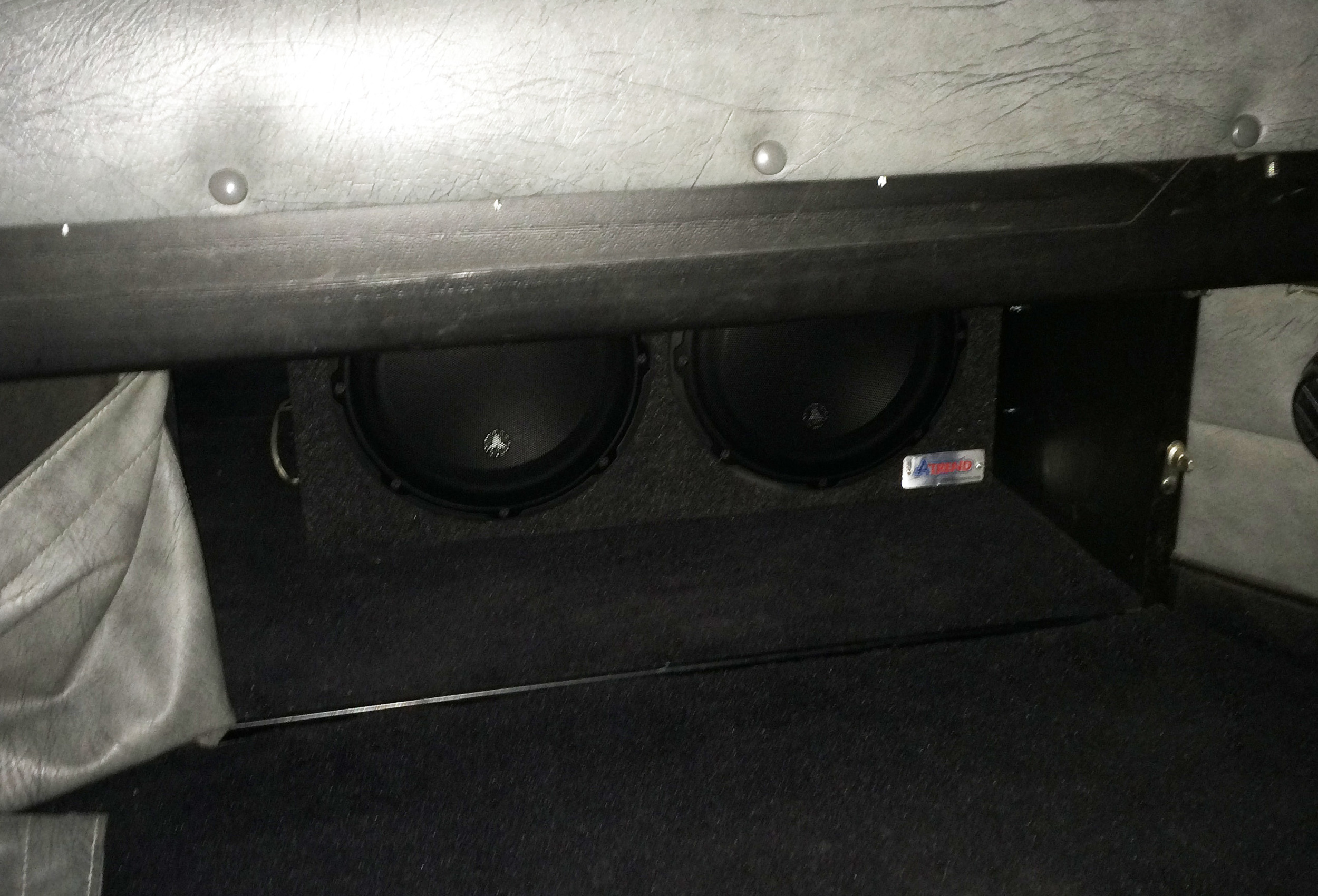 JL Audio 10W3v3 Subwoofers mounted under the sleeper