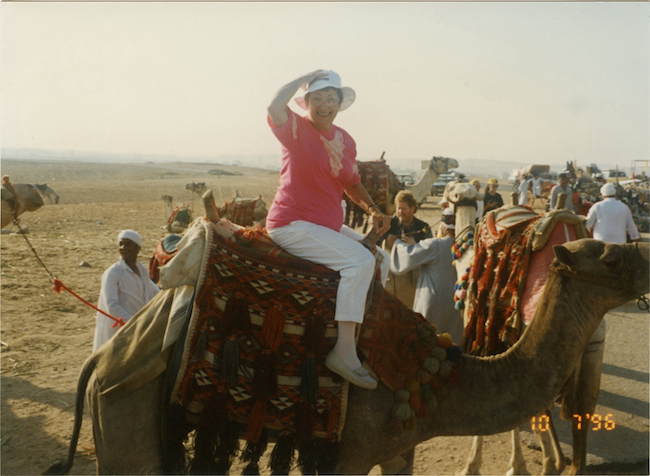 Mother on a camel in Egypt.