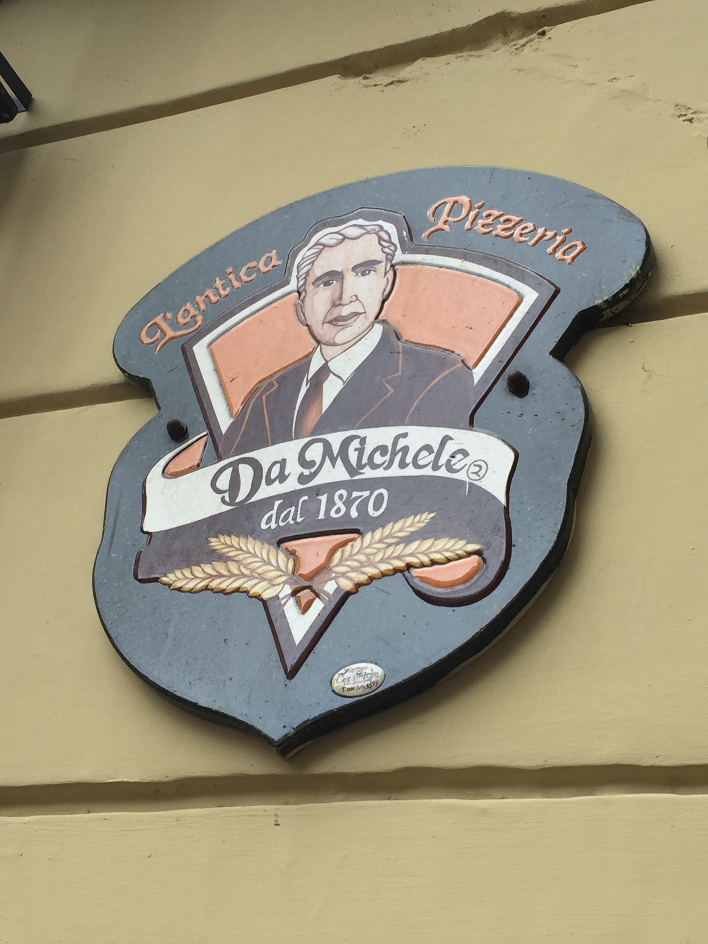 The crest of the venerable pizzeria.