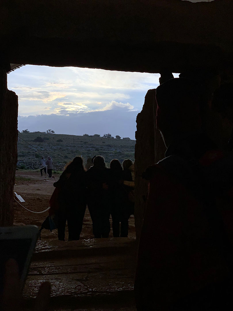  Inside Mnajdra Temple, looking out toward the spring equinox sun rising from behind the hill.    