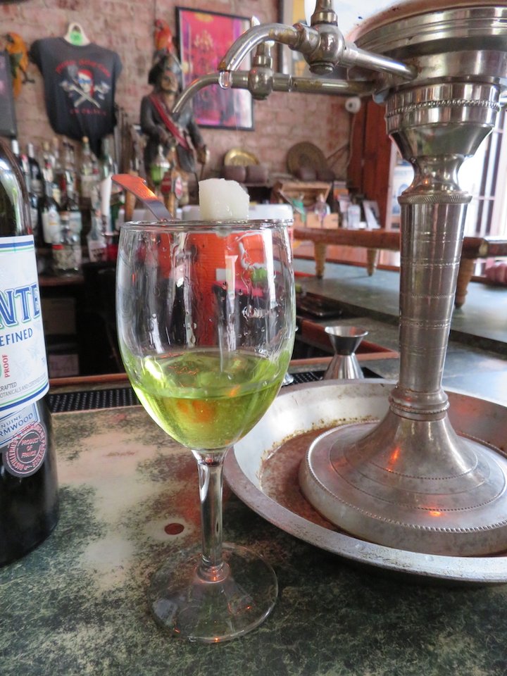 2. Pirate Alley Cafe glass of absinth and fountain.jpg