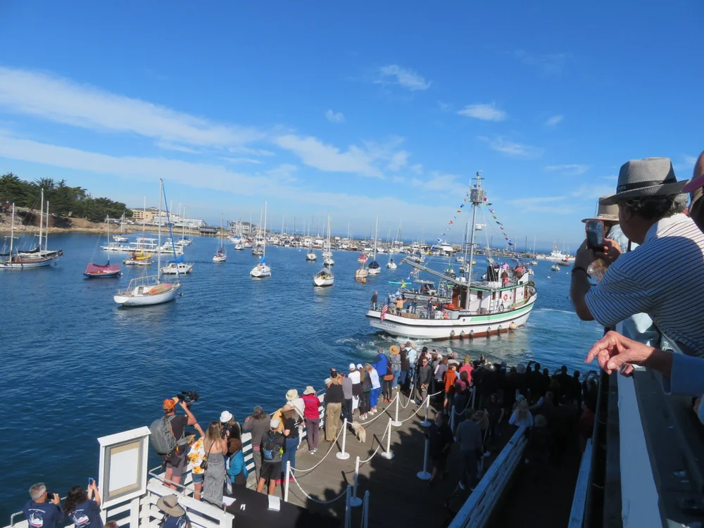 Western Flyer approaches and welcome crowd.JPG