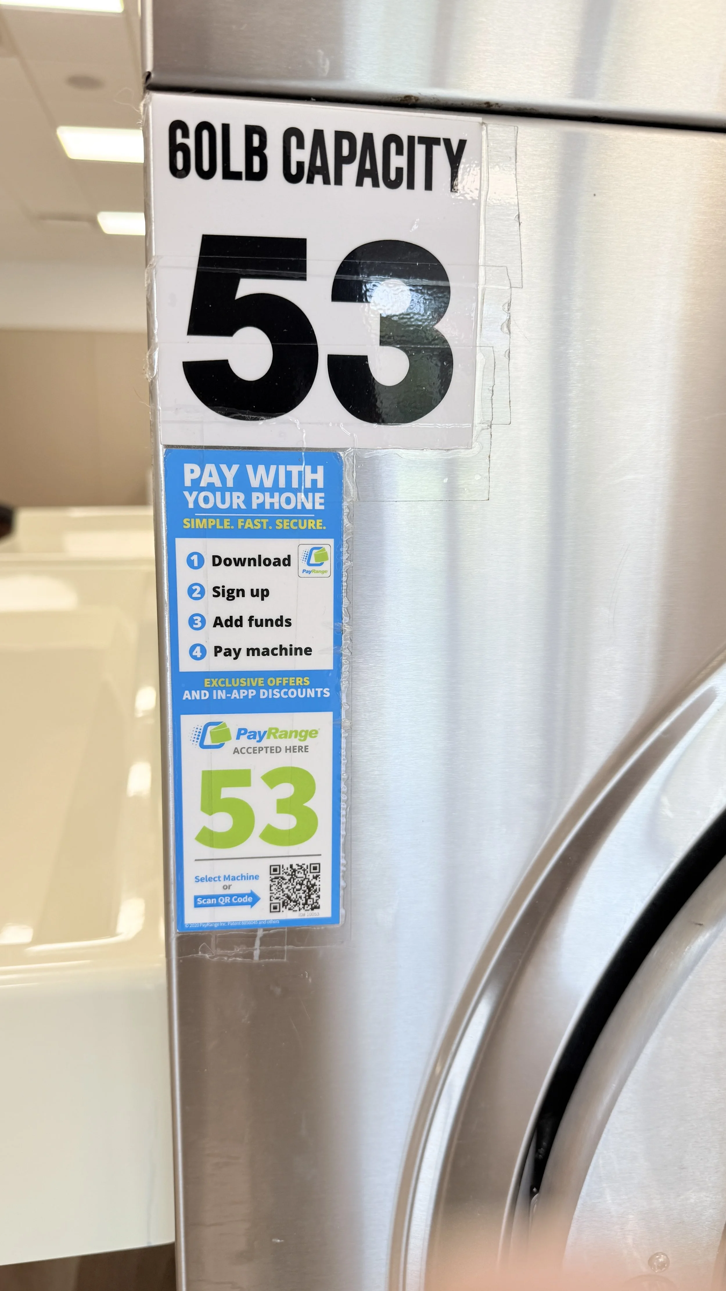  CloseUp of Laundry machine QR code for App use 