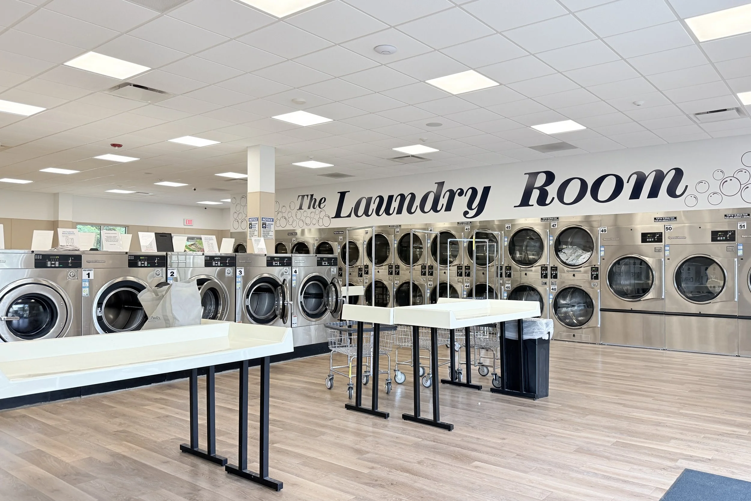  People folding Laundry in Lake George Laundromat 