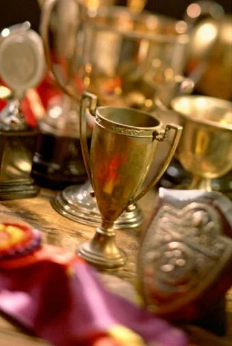 Photo of old gold-plated commemorative trophies that can be recycled and refined by Gold Refiners.com, part of Specialty Metals Smelters & Refiners.