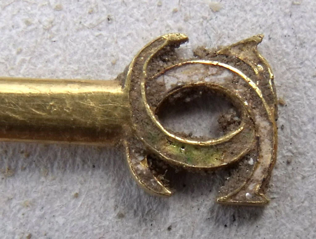 Close-up photo of the 4" long hairpin that once belonged to Catherine De Medici and was found while excavating a latrine at Fontainebleau. Credit: AP.