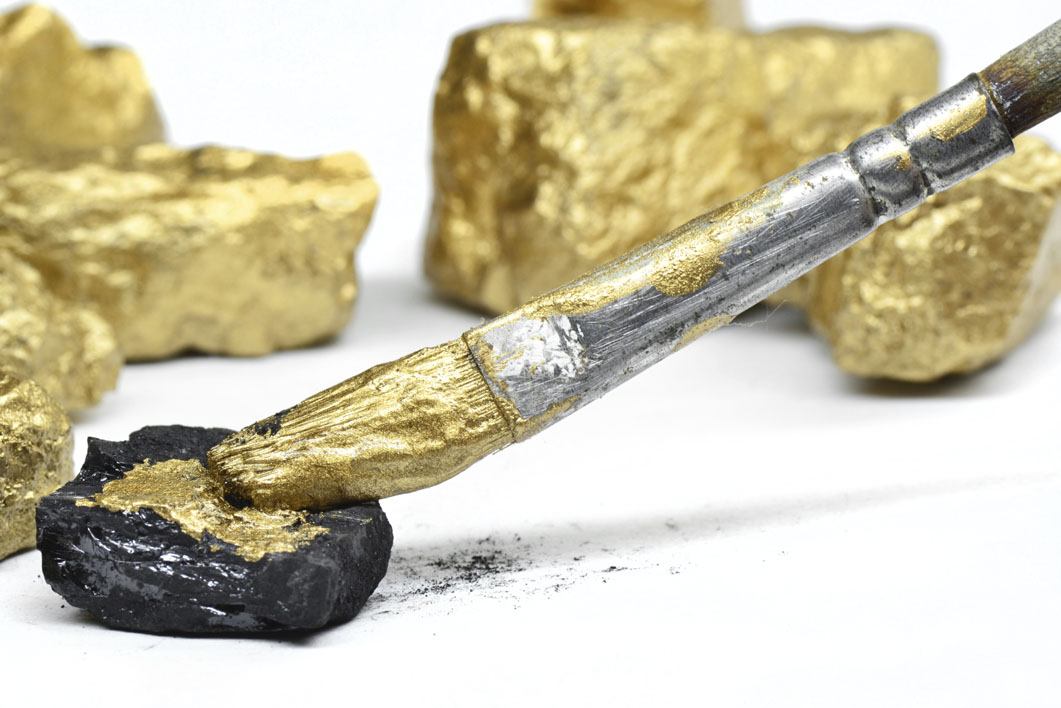 Image of fake nuggets being painted gold for a blog post about how to avoid making mistakes when buying, selling or recycling gold, posted on the Gold Refiners website. Credit: barbol88/iStock.