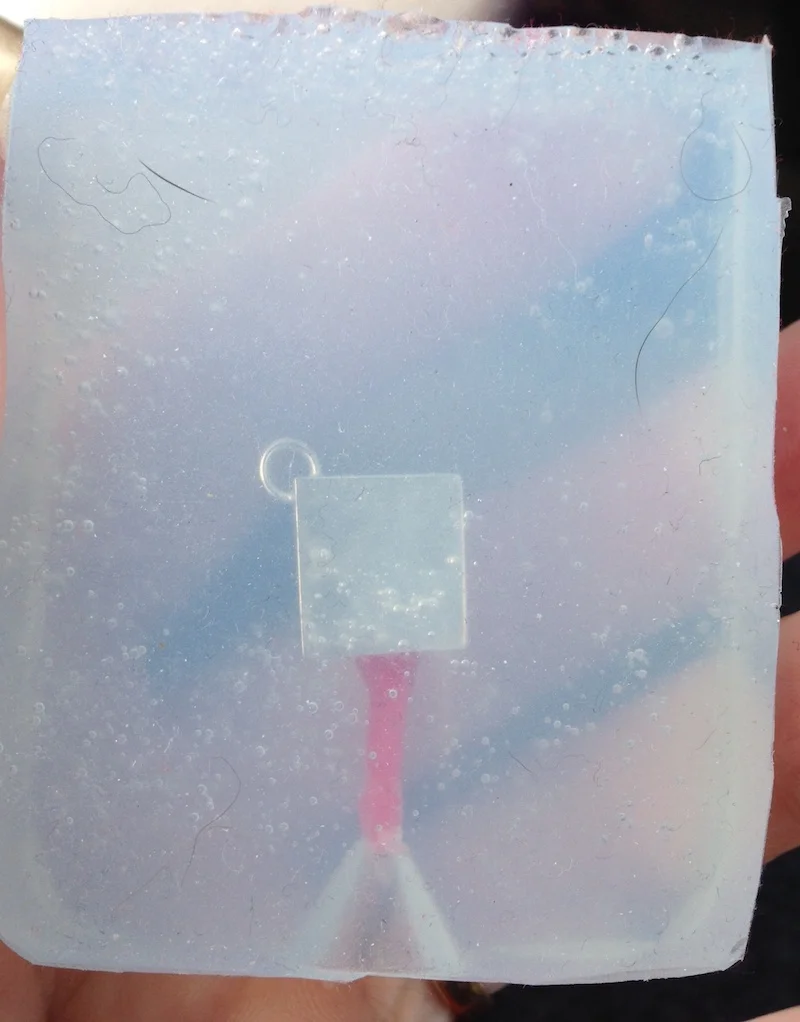 Original piece with sprue in silicone