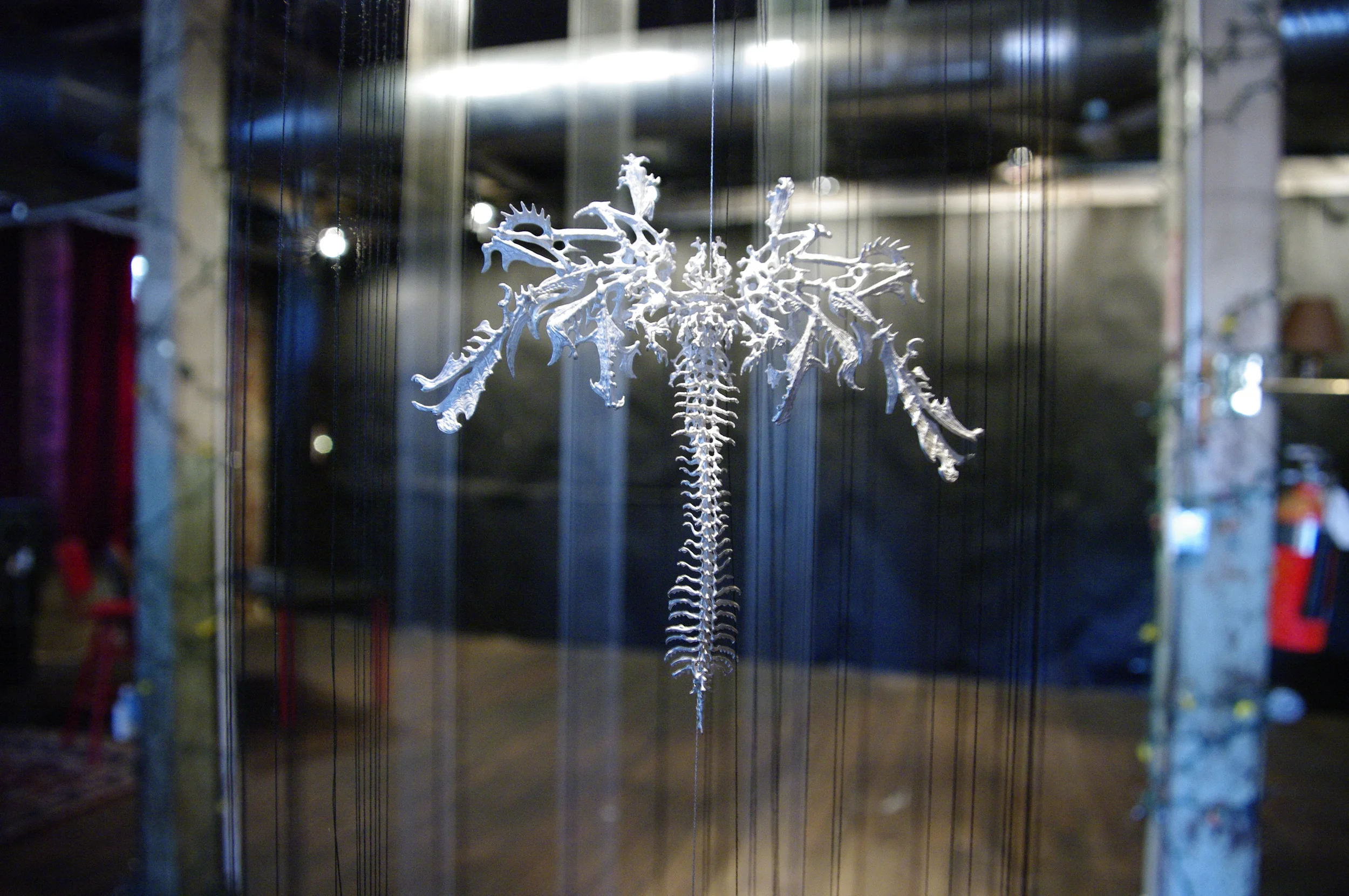  Ian Henderson, Silver sculpture encapulated in the only black thread cylinder.&nbsp; 