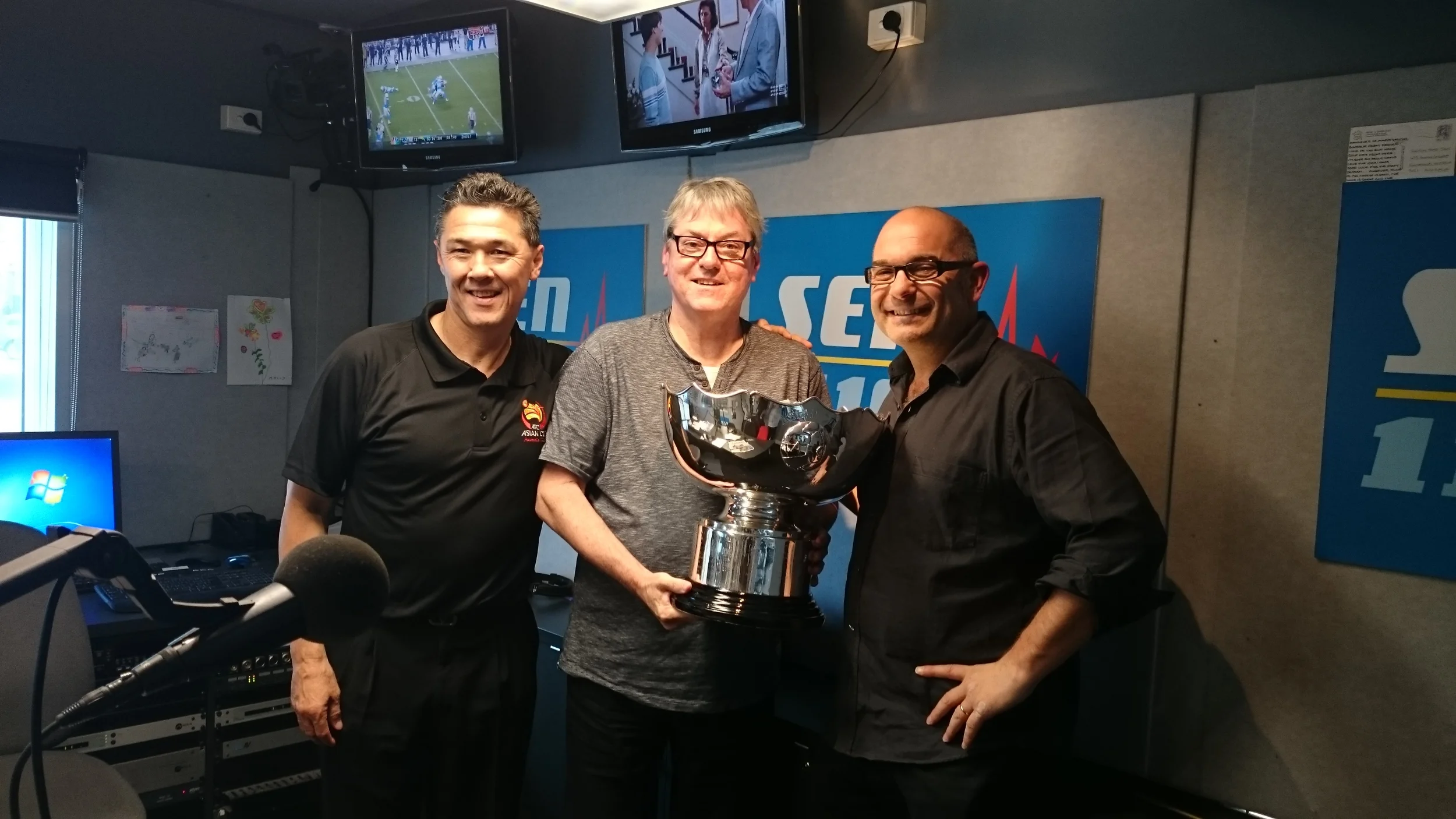 Socceroo legend Alan Davidson, SEN 1116's Kevin Hillier and Carlos with the Asian Cup 2015  