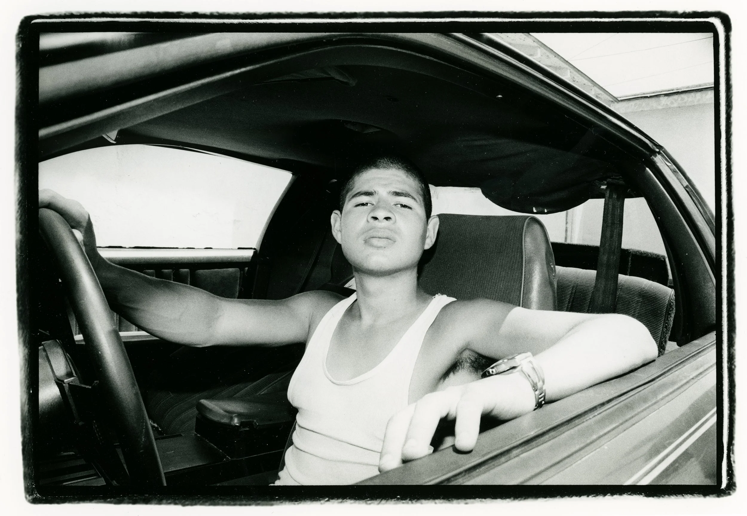 portrait.streetpoets.jorge.car.b&w.jpg