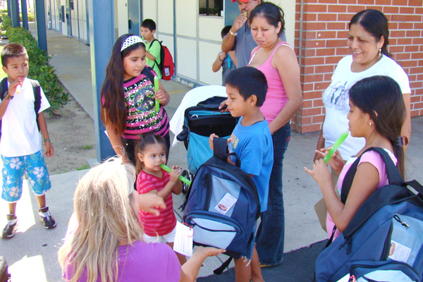 Delivering back packs at local schools