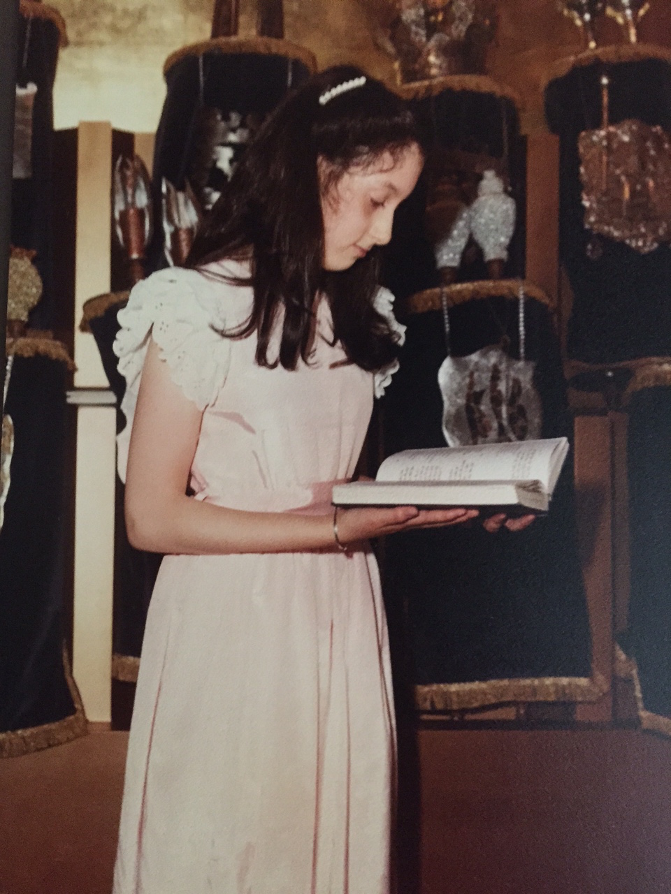 Erika Dreifus, pictured in front of the Torah scrolls at her home congregation in New Jersey, 1982.