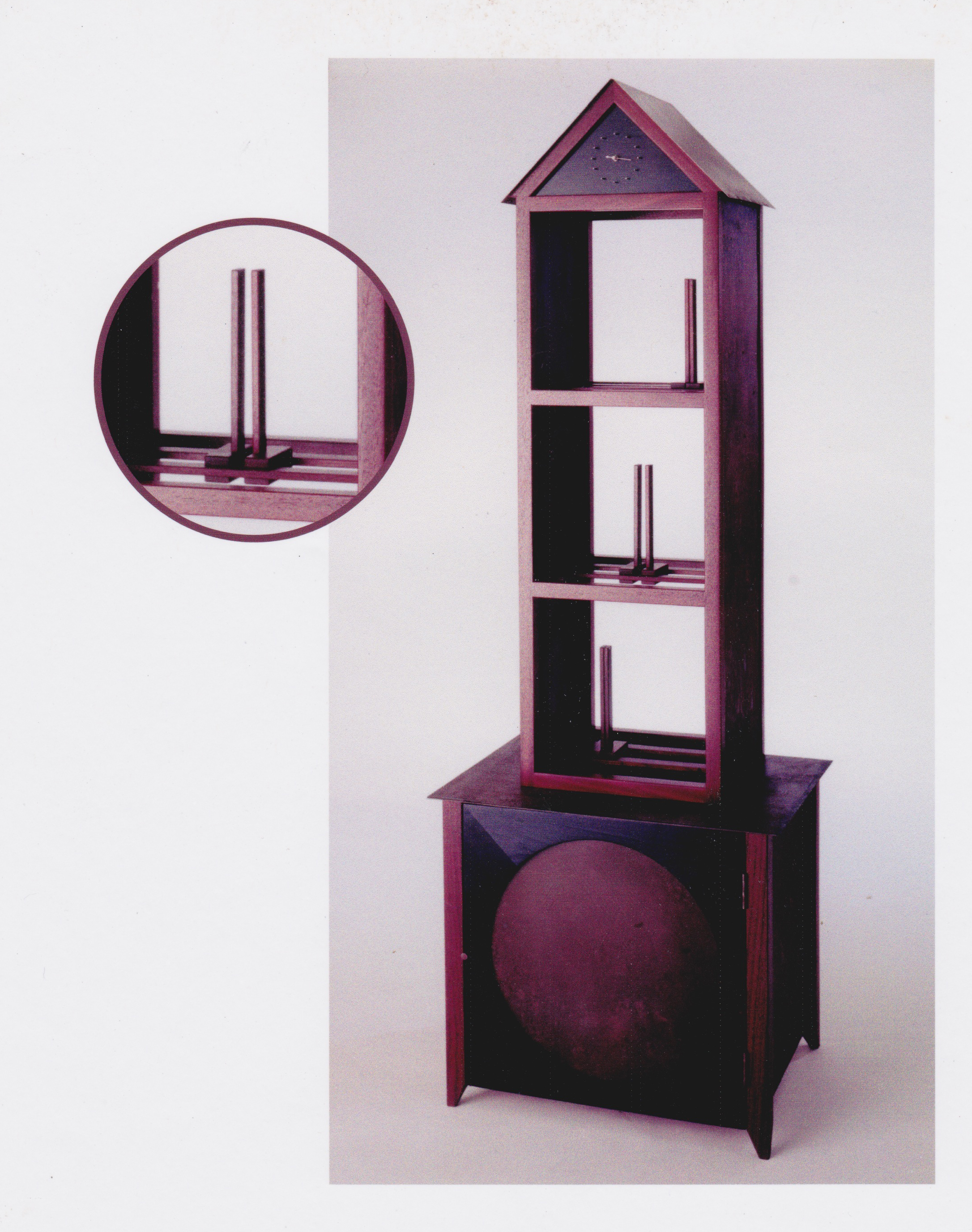 Tall bookcase with sliding integral bookends. Padouk and rusted steel.