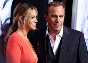 Costner and his wife at the red carpet premiere of his 2014 movie 3 Days To Kill.