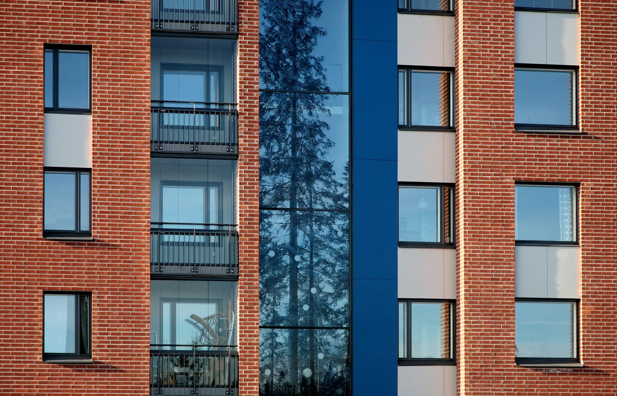 Apartment Building in Vuores, Finland. Architectural Office Lasse Kosunen with artwork by Tuula Lehtinen.