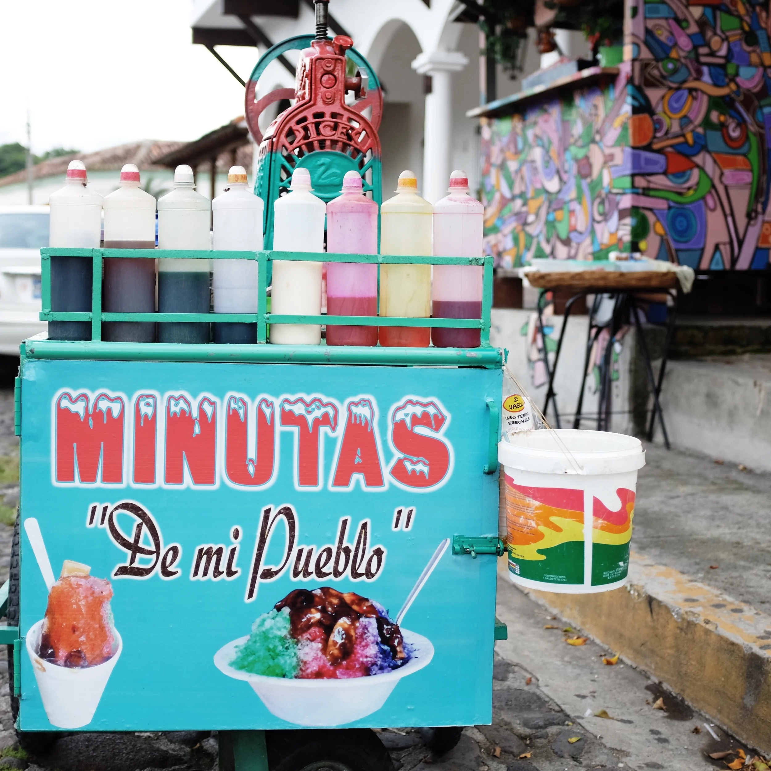Every town was guaranteed to have two vendors, a pupusa maker and a snow cone slinger. The snow cone carts were brightly painted so they could not be missed. 