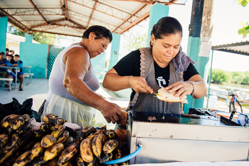 While men harvest coconuts from the islands surrounding Puerto Parada, the women make fresh grilled sandwiches to feed them upon their return. Plantains stacked high are a tasty snack and common culinary ingredient in El Salvador. 