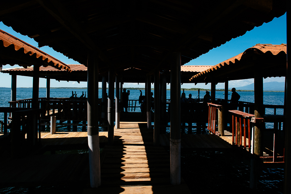 the We had lunch at the end of this open air dock, cool breeze stirring our cheeks as we ate. To the far right, you can see a volcano in the distance across the bay. 
