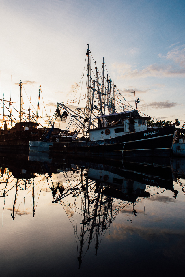 Fishing boats docked at Puerto Barillas at sunset, taken from my perch in a kayak. 