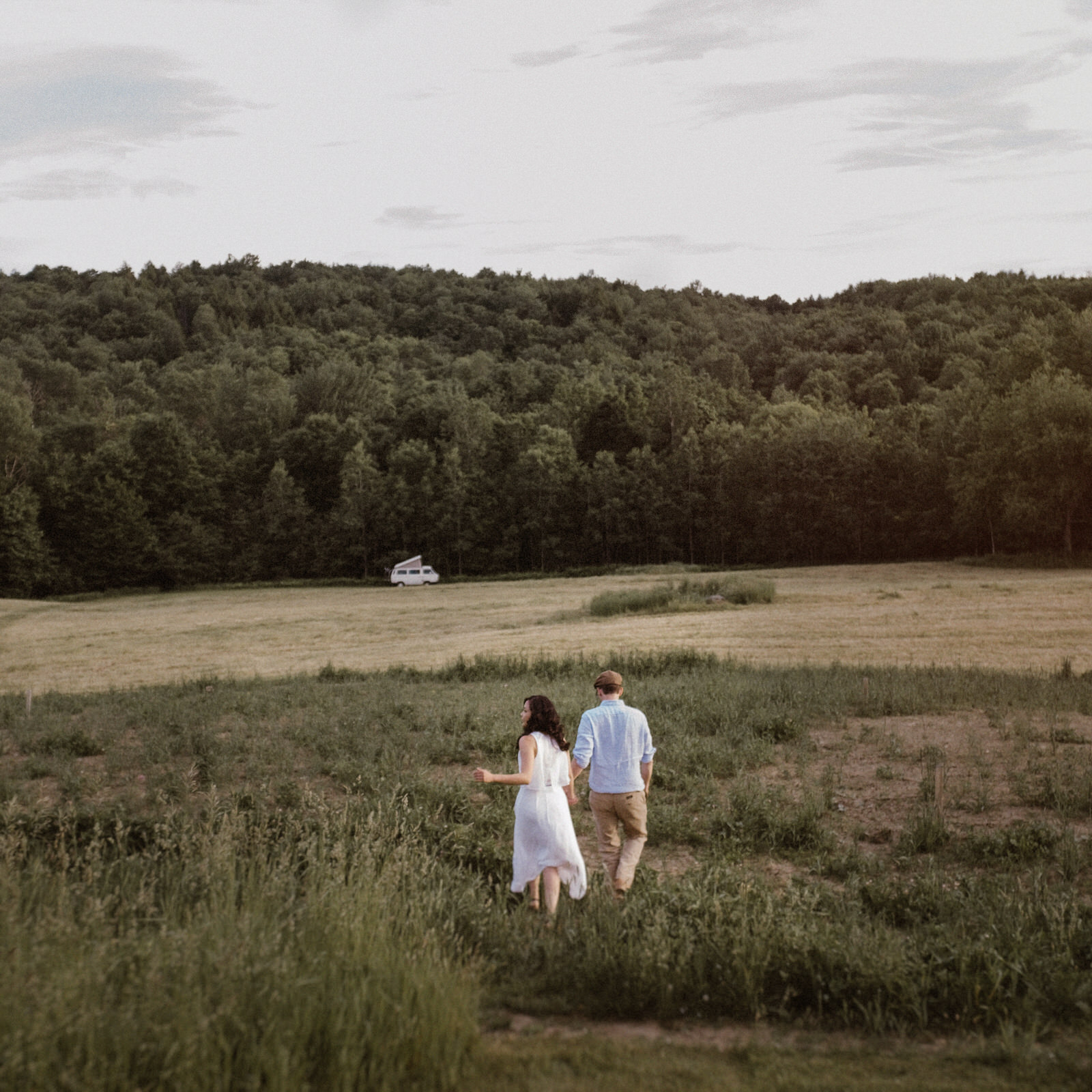 Eastern Townships wedding photos, married couple running in field