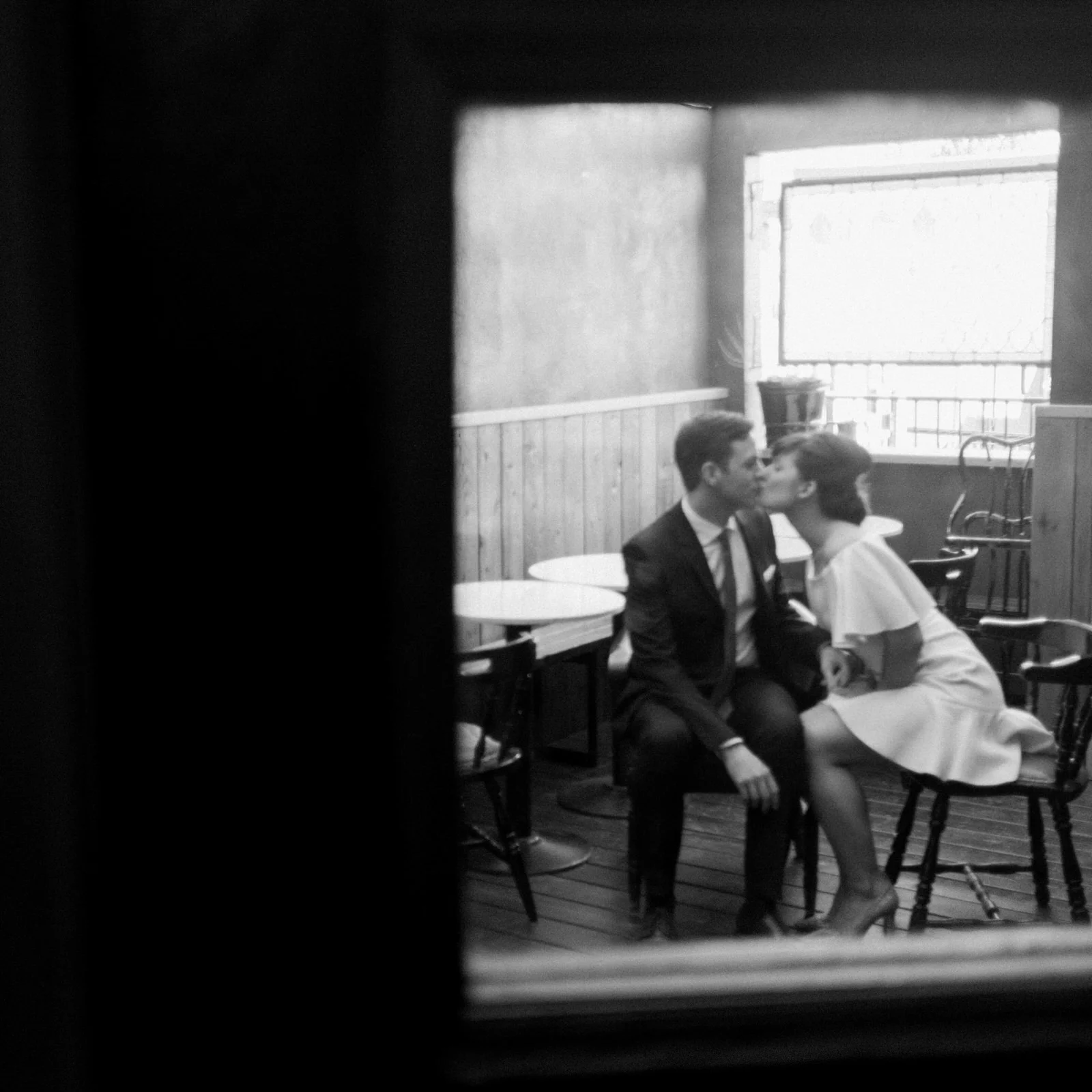 Black and white again, (no surprise) a little blur, a little haze, a sweet embrace, the kind of romantic expression that happens in the moment. I look for these frames endlessly. 
