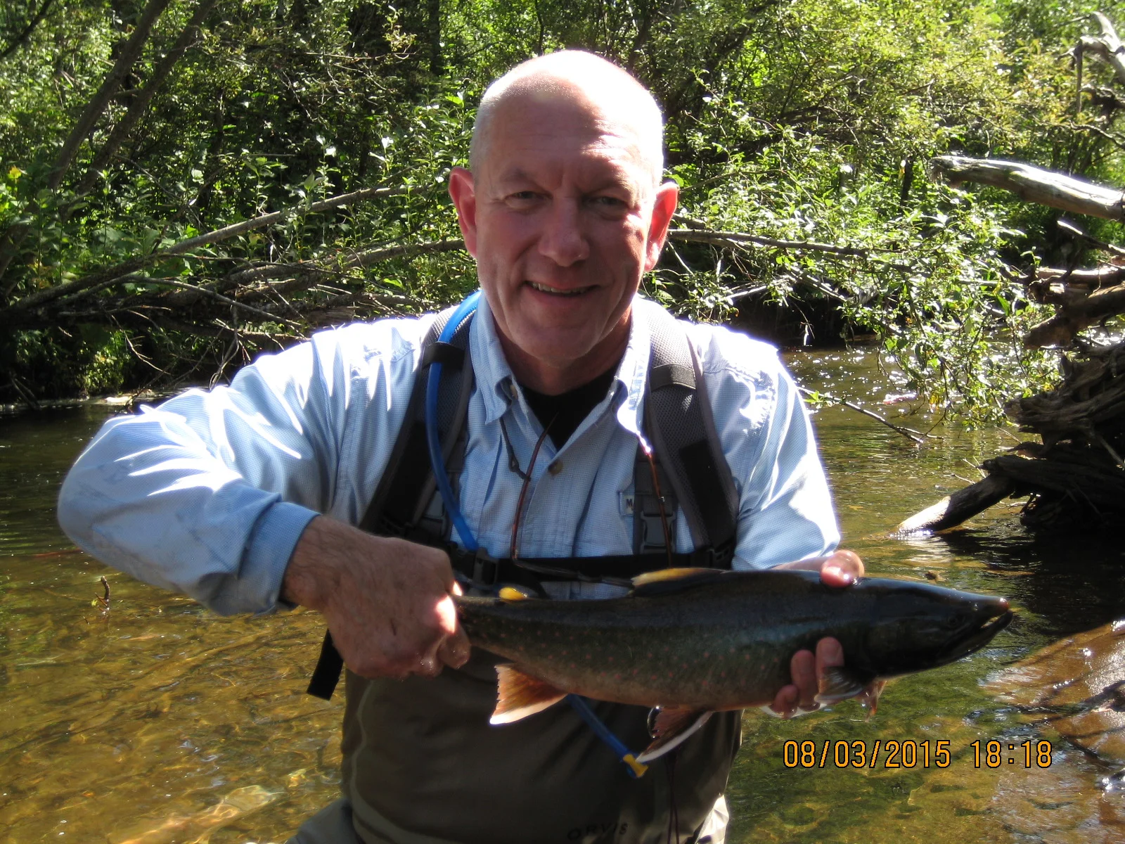 A "Dolly" about two-feet long. I'm wet and muddy because I dropped the fish and crawled after it until I caught it again. Hey! If the bears can do it, then I can do it. It was not graceful though.