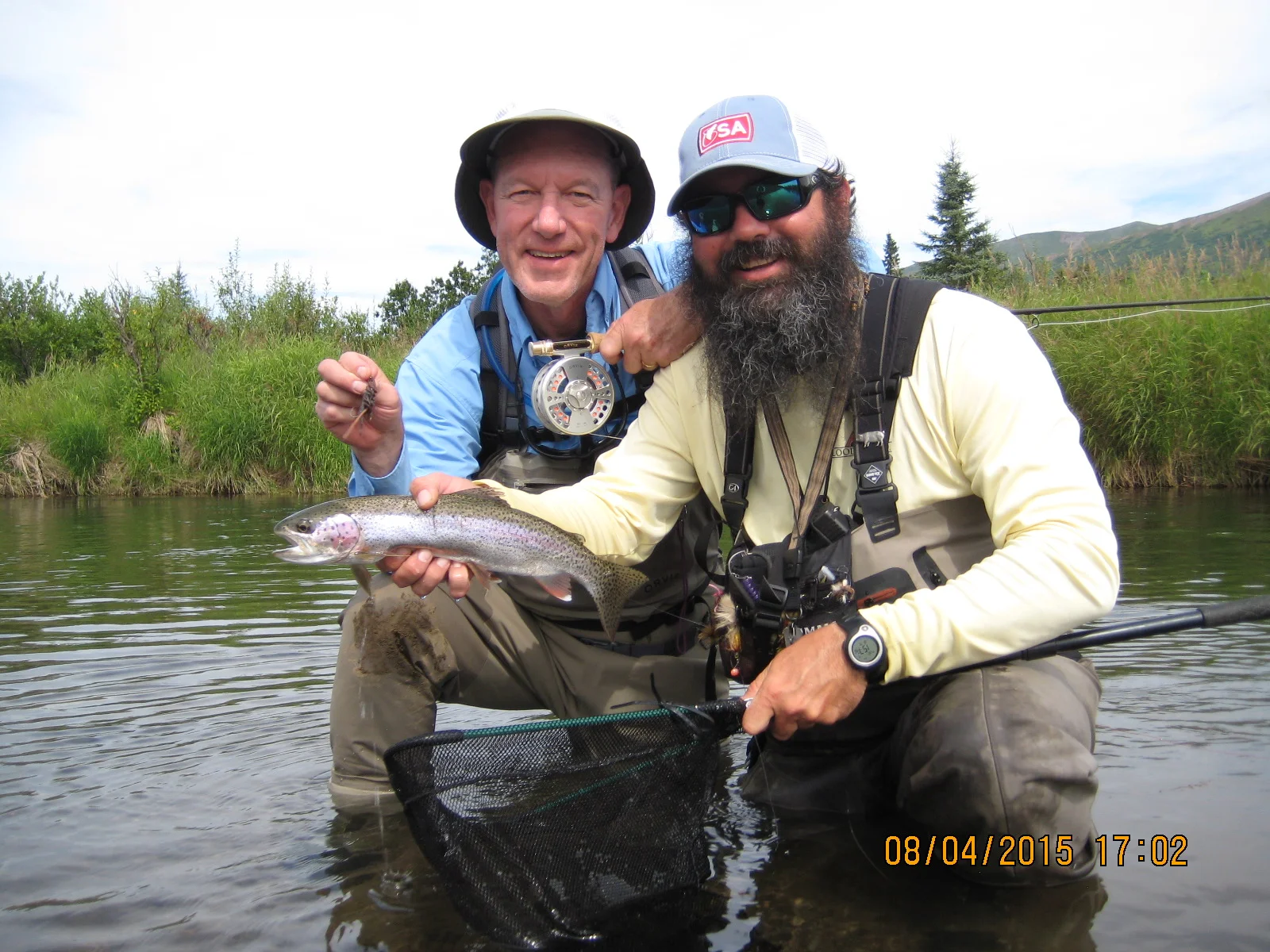 Rainbow trout on a mouse pattern. As a point of clarification, I'm on the left holding the mouse, Greg-the-guide is on the right holding the fish. Note the 10mm Glock stuffed in his waders on a bandolier holster. 