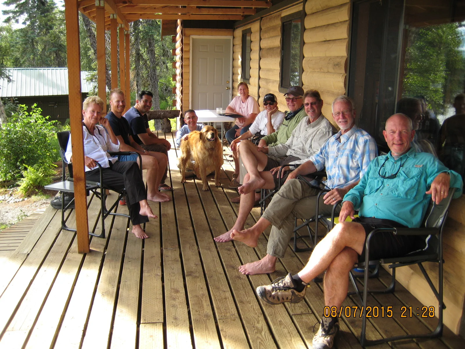 On the porch after a great day fishing. From the left, Maggie, Rob, Dave, Stephen, Parker-the-dog, Leslee, Diane, Lee, Harper, Don, and me. 