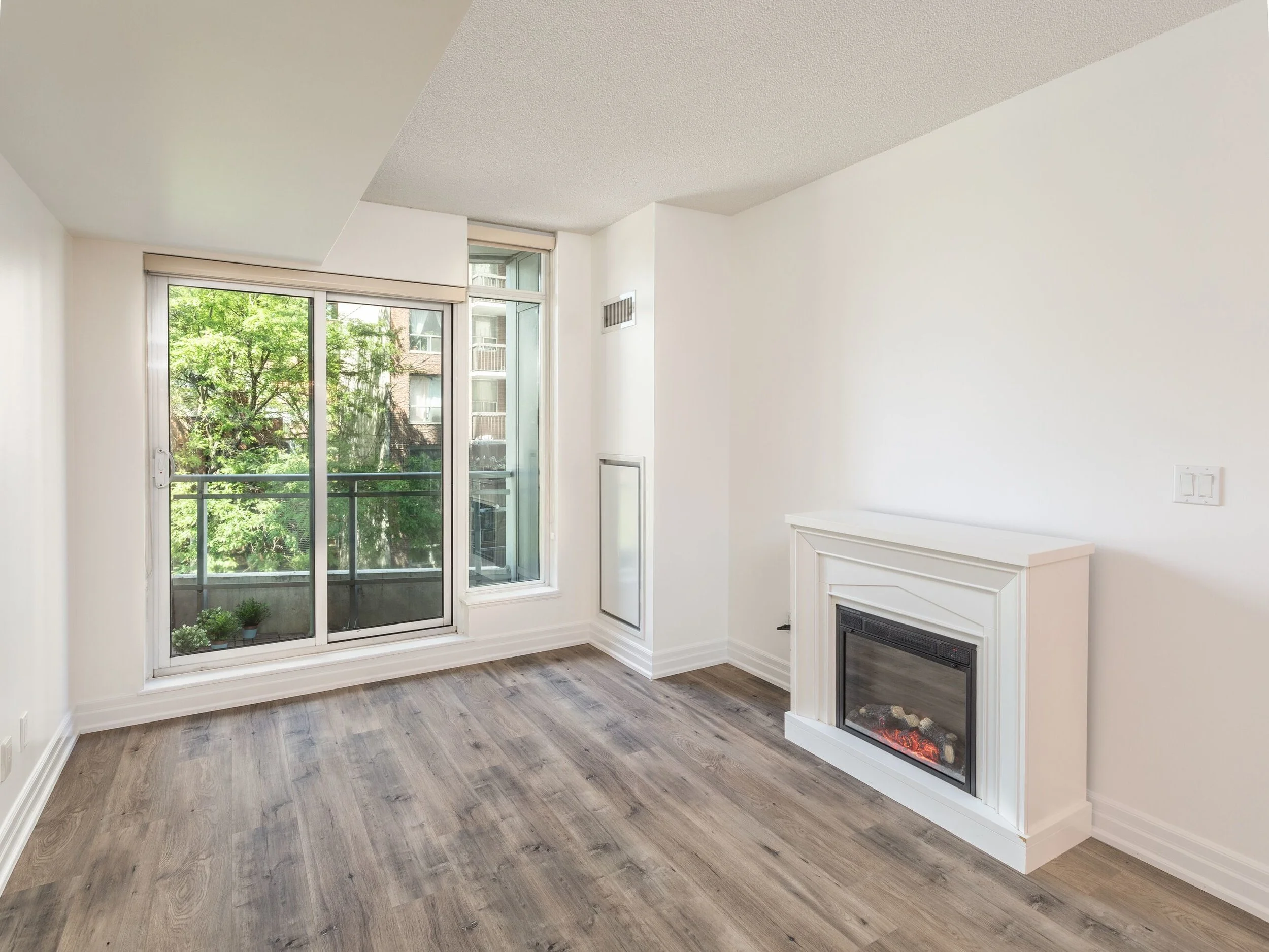 Living area with fireplace and balcony