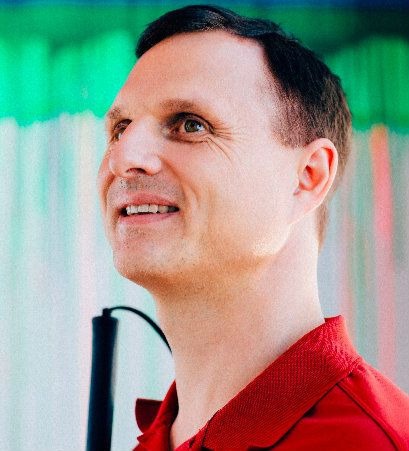 Photo of Matt King wearing a red shirt