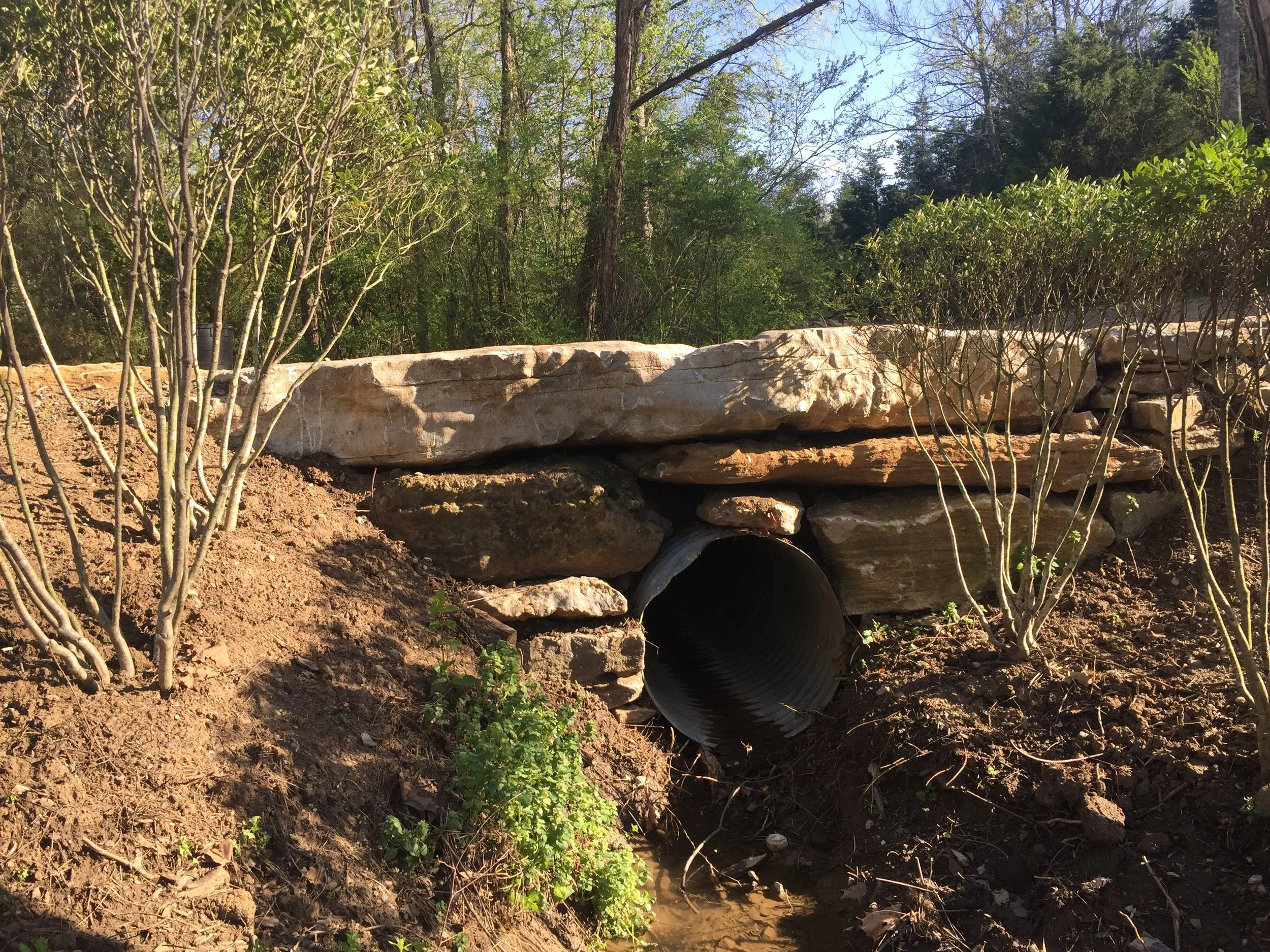 Installed stone to hide drainage culvert