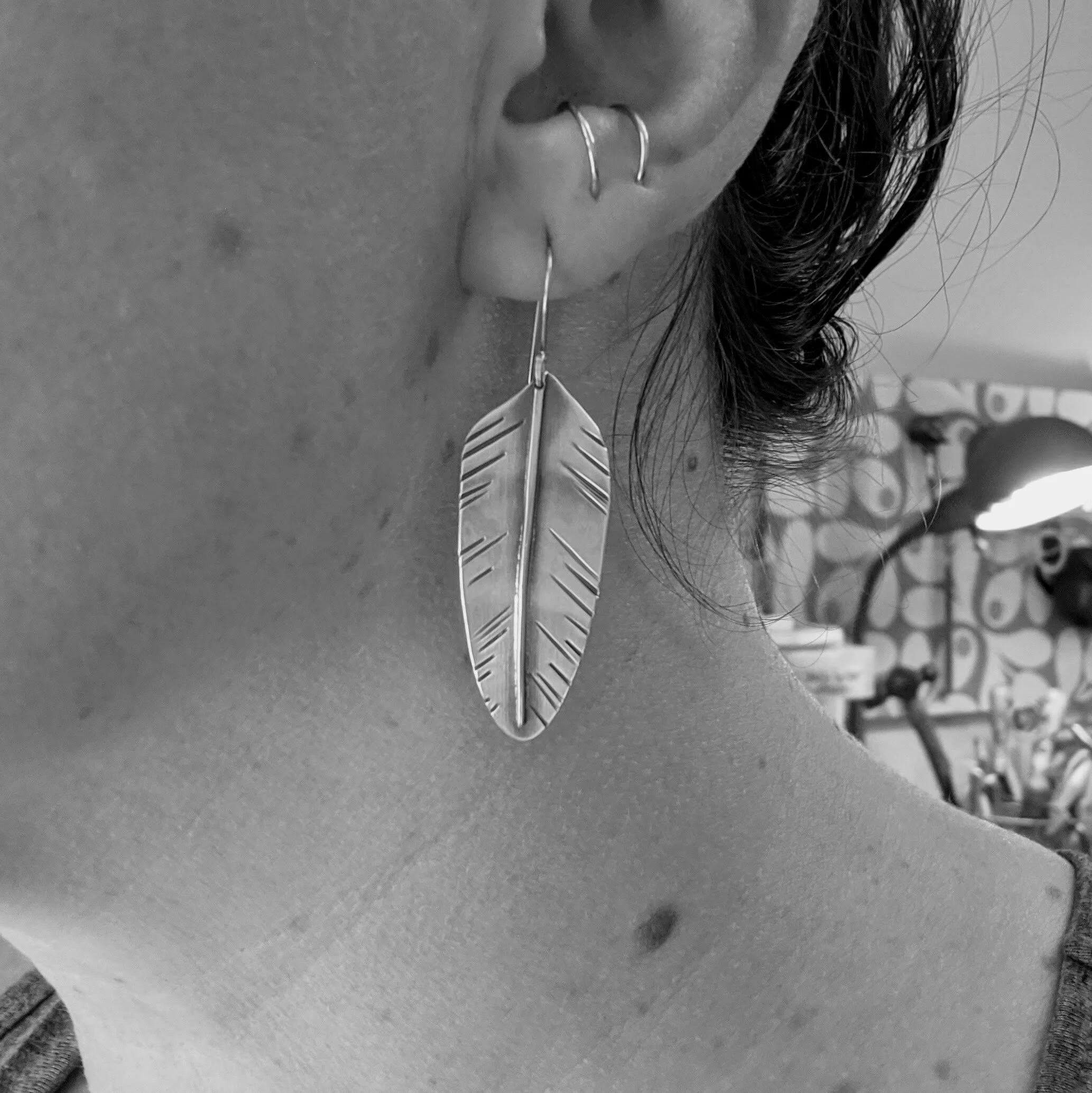 nature-feather-earrings-sterling-brass-model.jpg