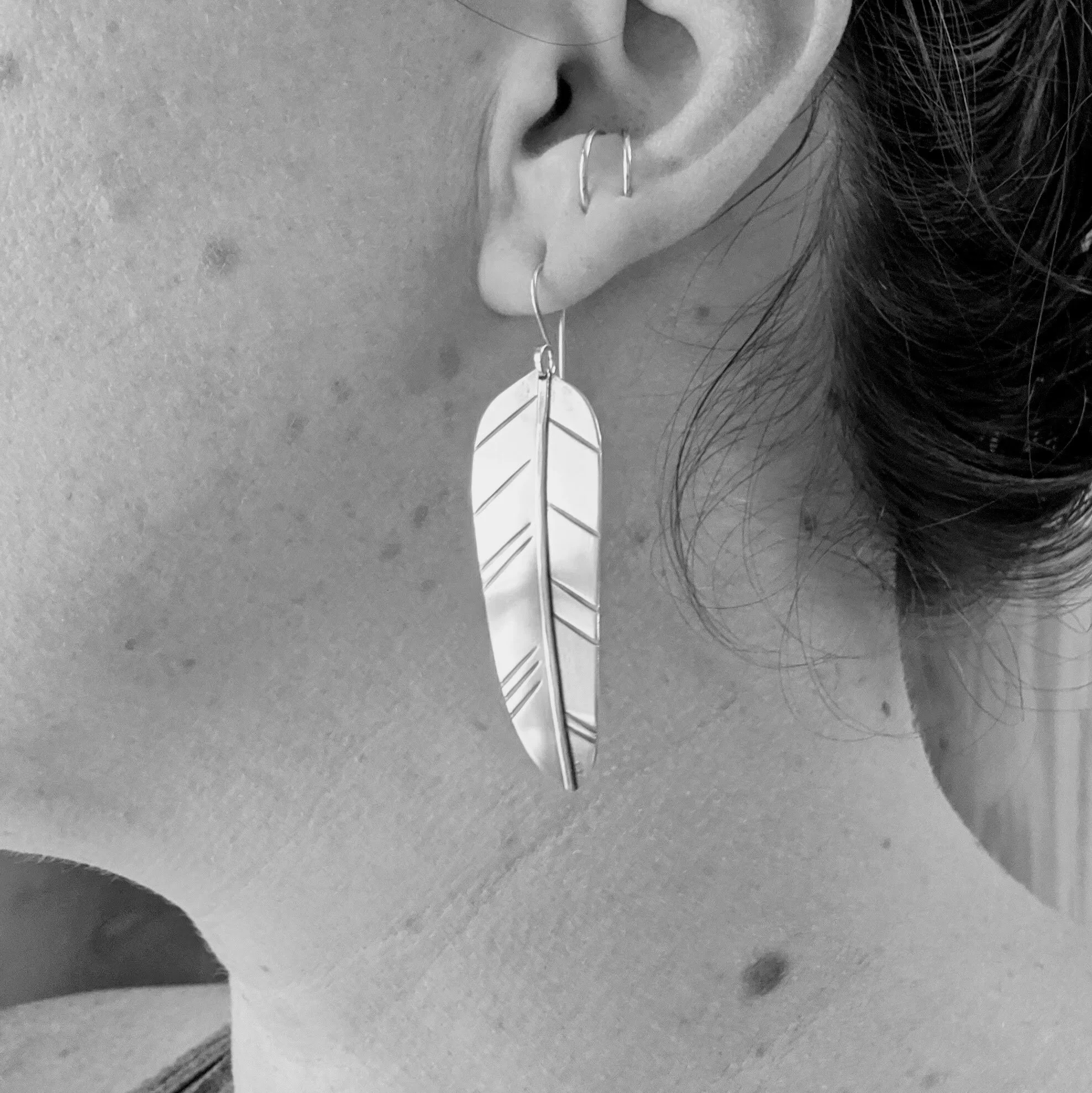 nature-feather-earrings-brass-jewelry-model.jpg