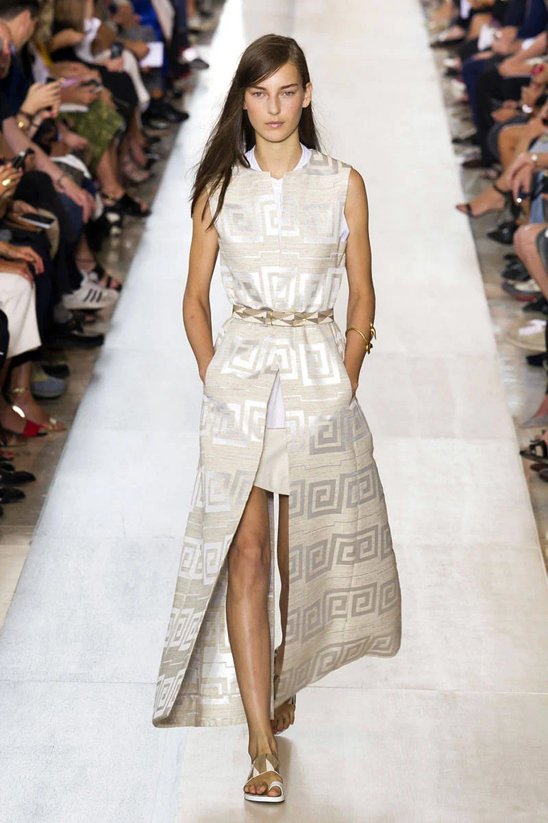 Tory Burch. This is a longer style used as a dress over a shorter dress
