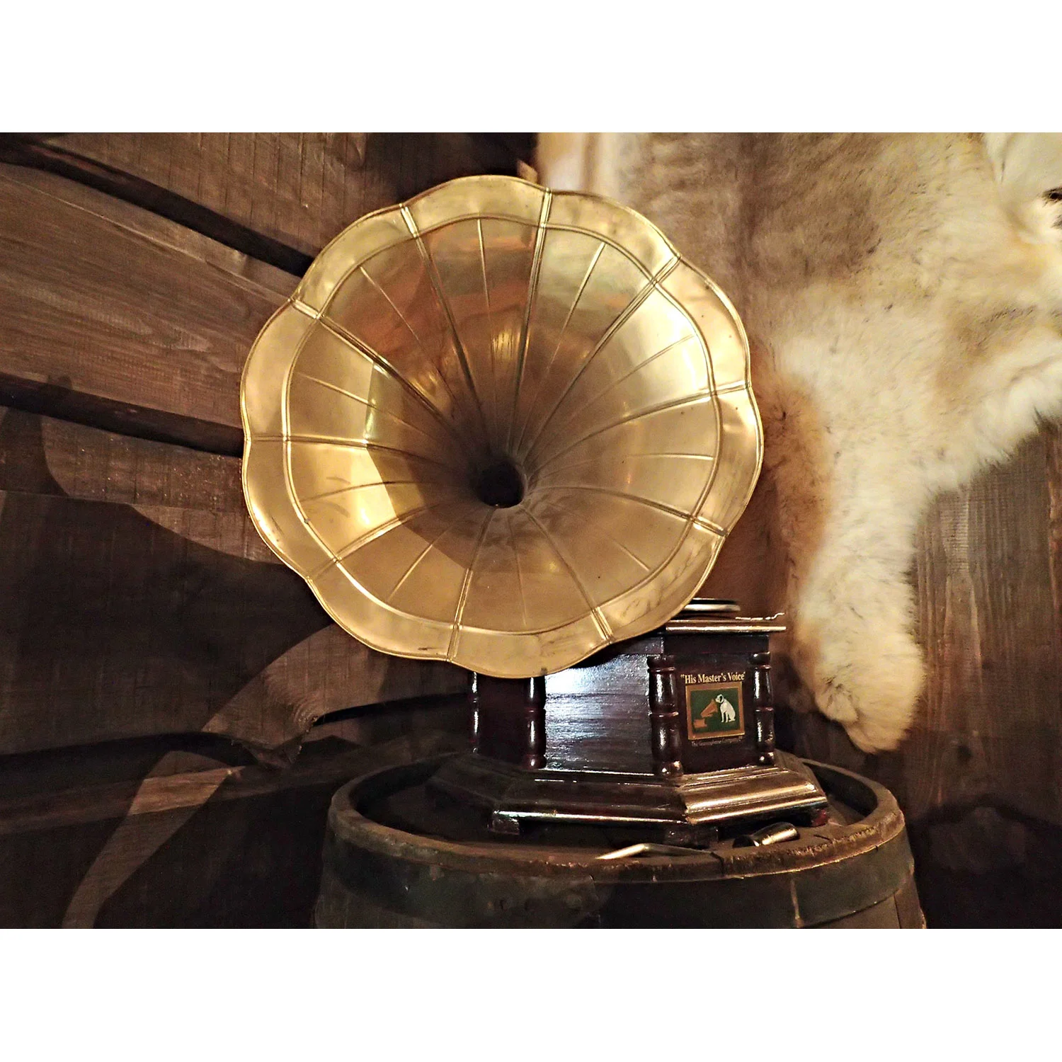 One of my favorite pieces was set-up on a old timey barrel in front of a fur hanging on the wall: A wind-up 1900s gramophone from His Master's Voice company with the company logo of the dog named Nipper listening to his master's voice on a wind-up gramophone. (Very meta.)