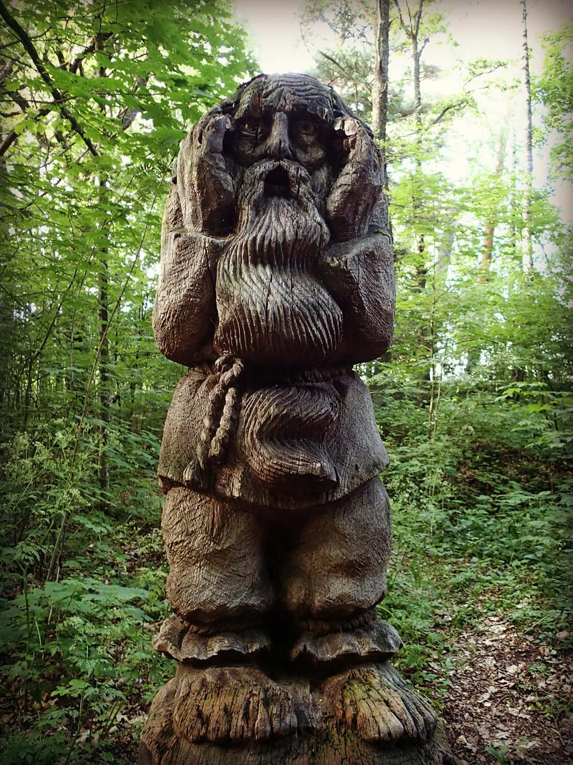 Oh no! We've wandered onto Raganų Kalnas (the Hill of Witches). In 1979, this National Folk Art Sculpture Park was created to revive ancient stories & pagan traditions in the form of the Lithuanian art of tree carving. Now with 80+ tree carvings, the witch's mountain is divided into two parts: light & dark. The bright part of the trail is wide & filled with famous Lithuanian fairy-tale characters. On the second half, the path narrows & darkens which is where the devilish carvings begin.